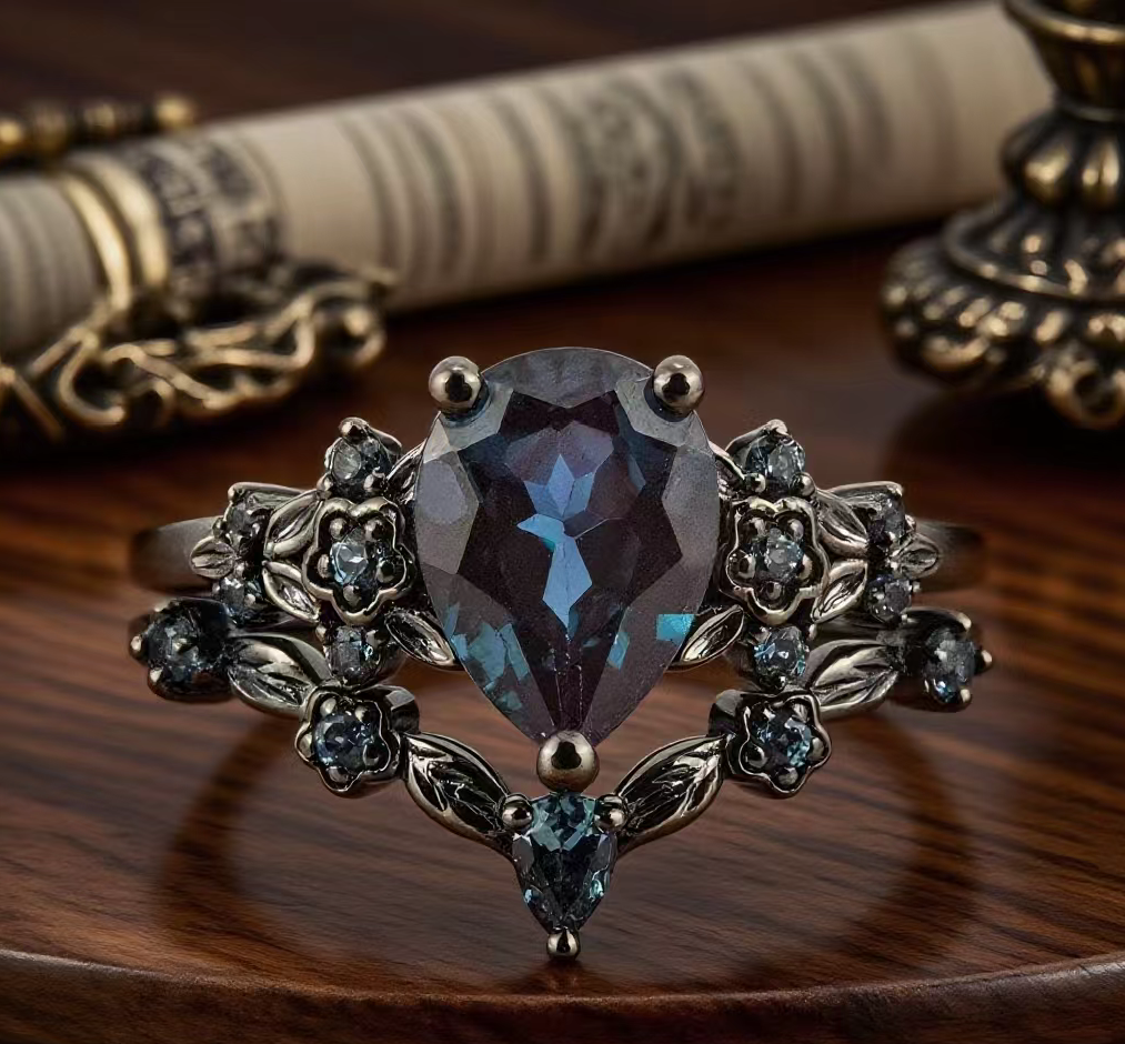 Botanical Elegance: The Enchanting Pear Cut Lab Alexandrite Black Gold Engagement Ring Set