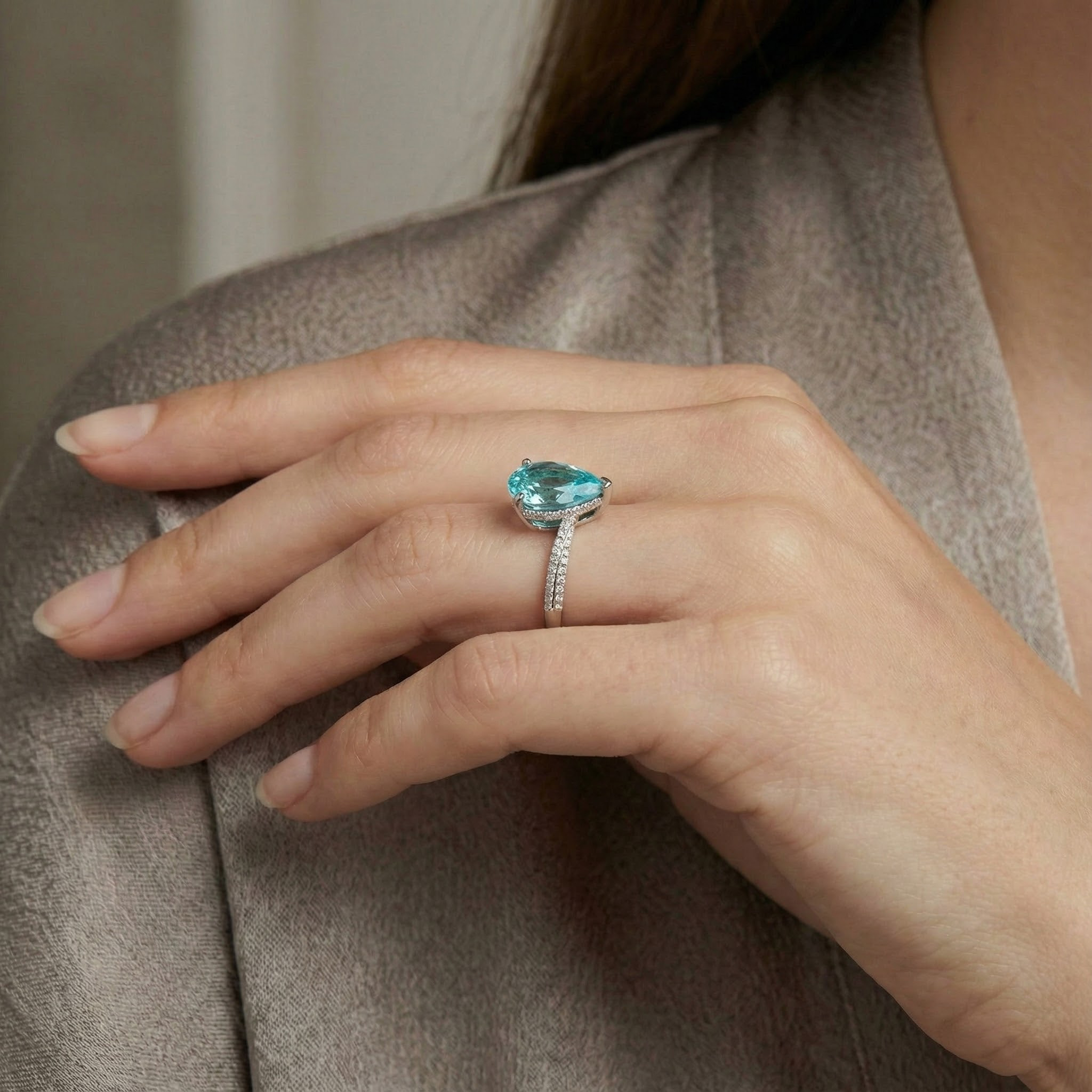 Elegant streamlined blue zircon ring featuring shimmering moissanite stones