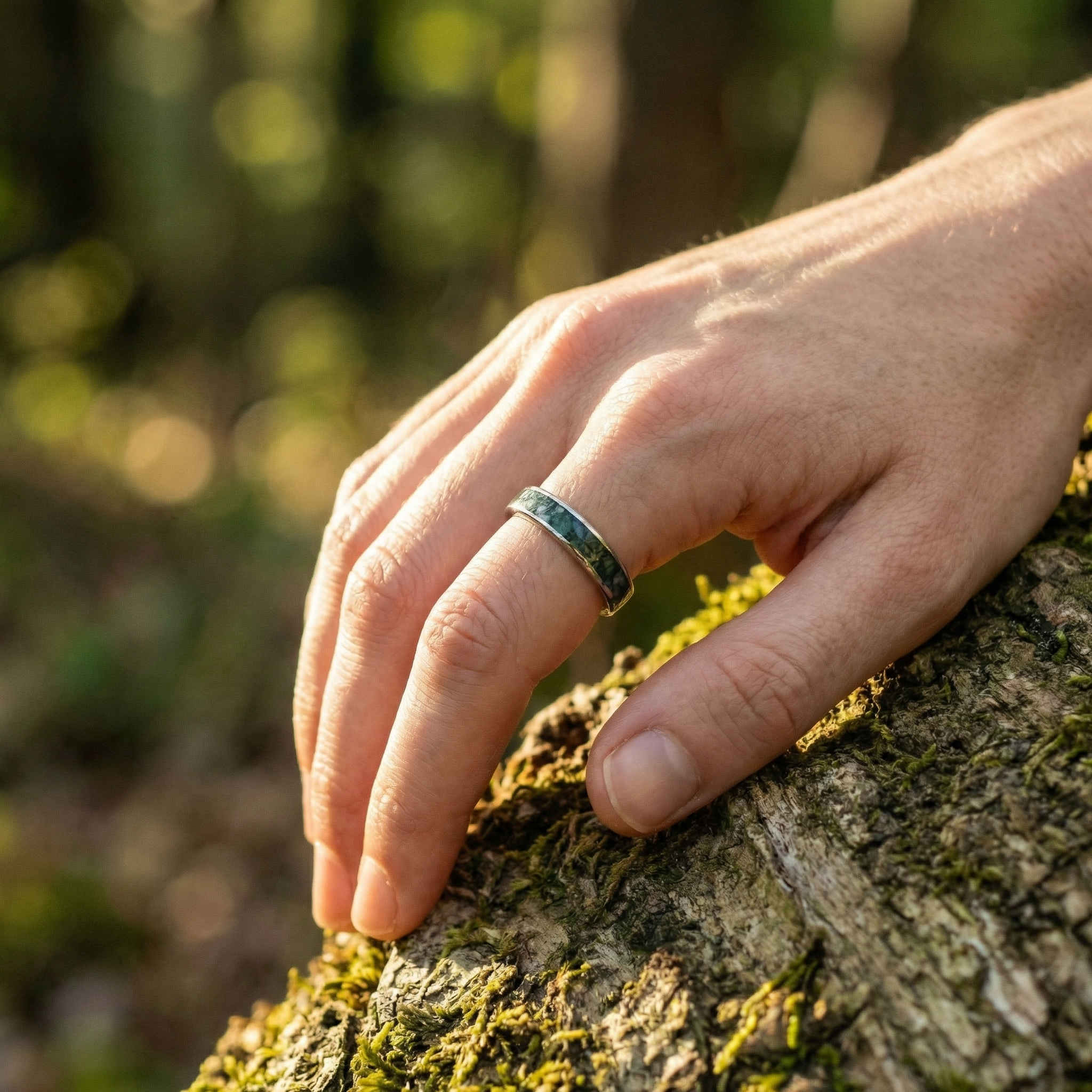Angled view of Moss Agate Wedding Band in Gold