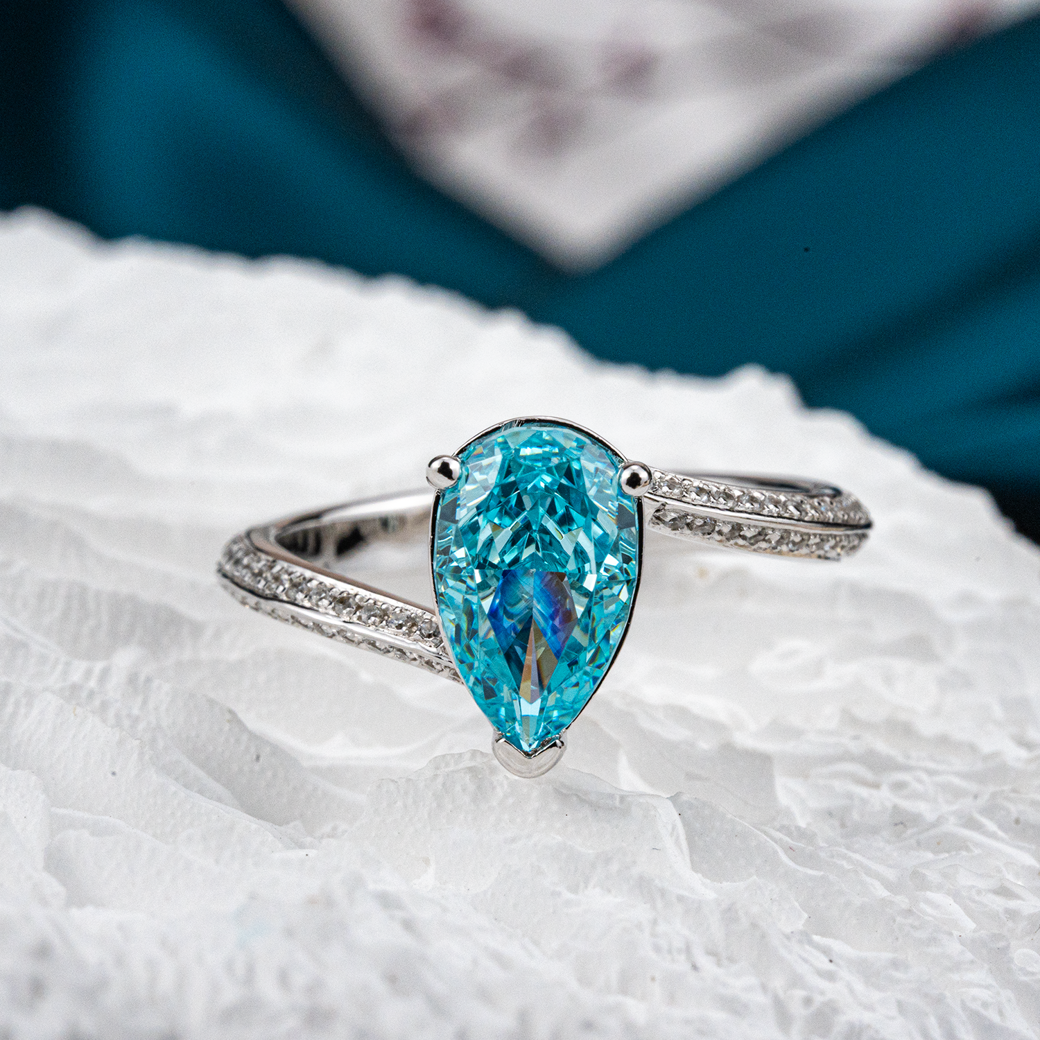 Elegant streamlined blue zircon ring featuring shimmering moissanite stones