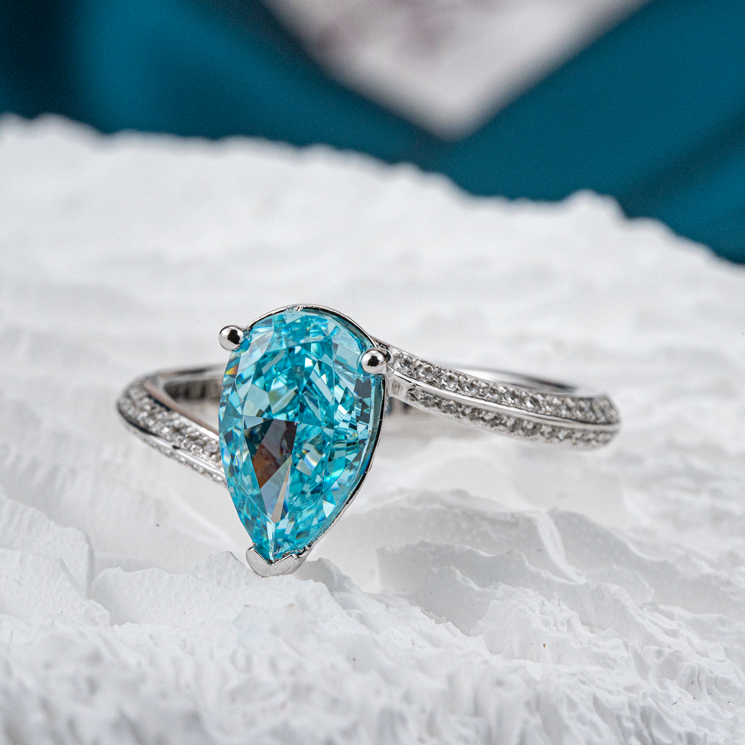 Elegant streamlined blue zircon ring featuring shimmering moissanite stones