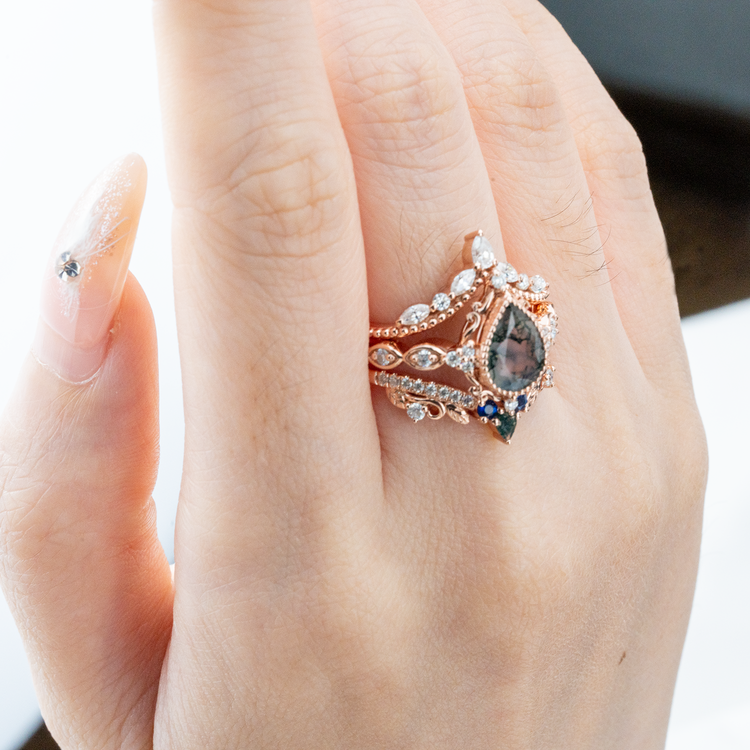 Exquisite wedding ring with pear moss agate stone, nature-inspired leaf design - luxurious and stunning