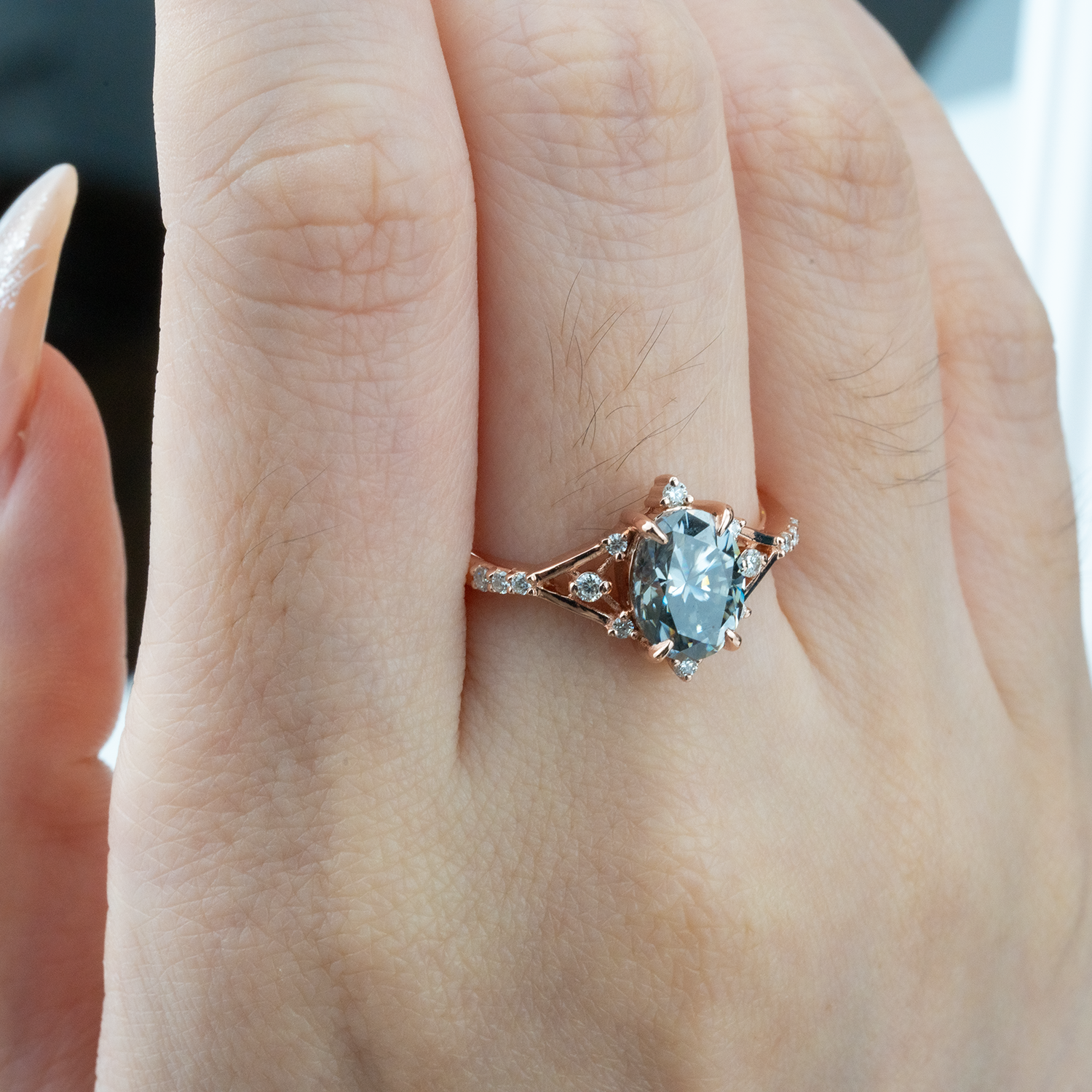 Stylish minimalist wedding band featuring an oval gray stone, chic design