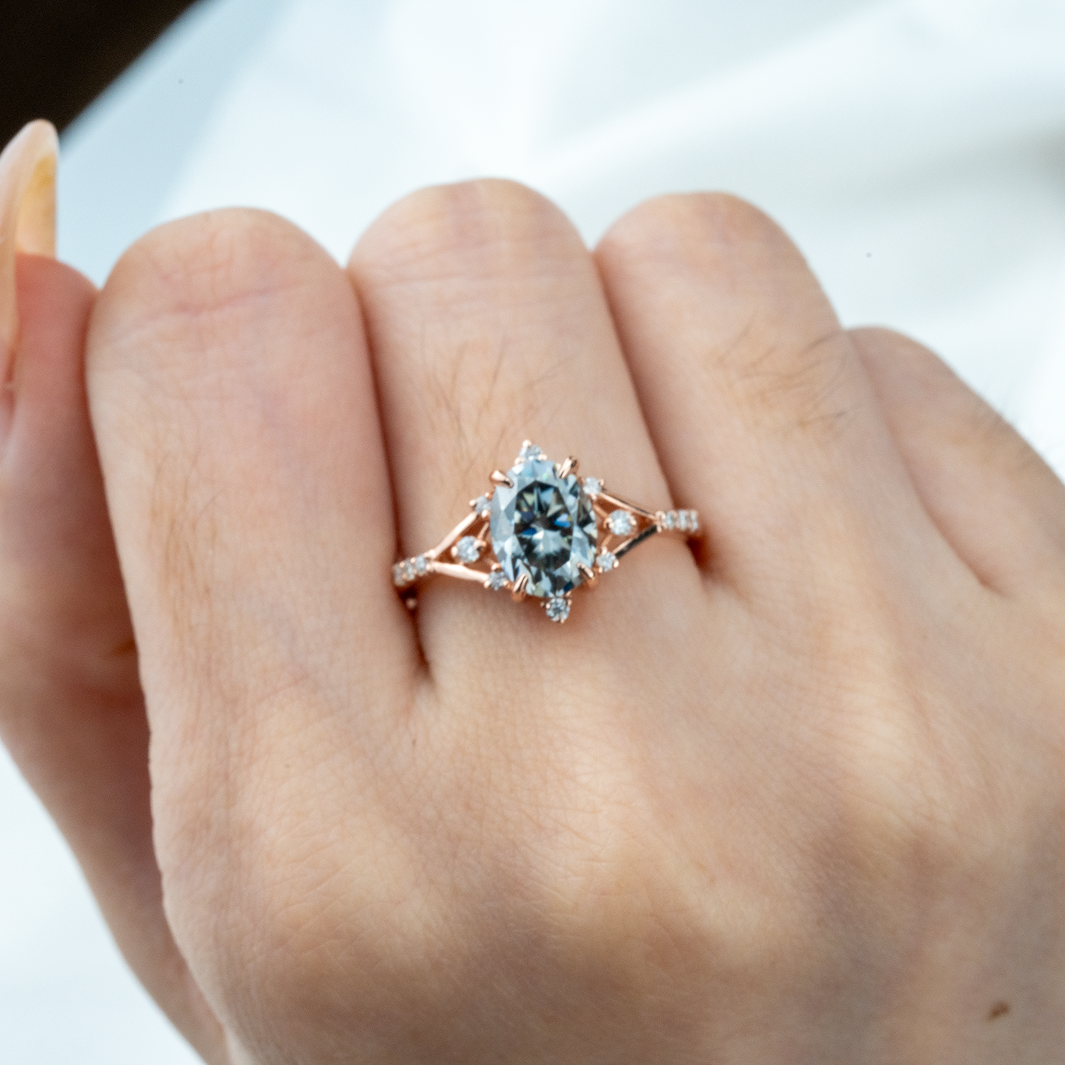 Stylish minimalist wedding band featuring an oval gray stone, chic design