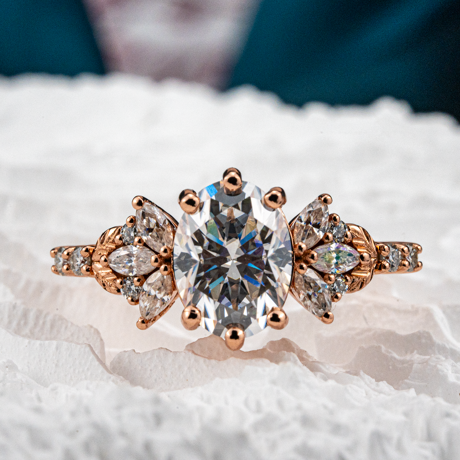 Elegant handmade oval moissanite ring featuring a delicate leaf motif, perfect for adding a touch of nature to your look.
