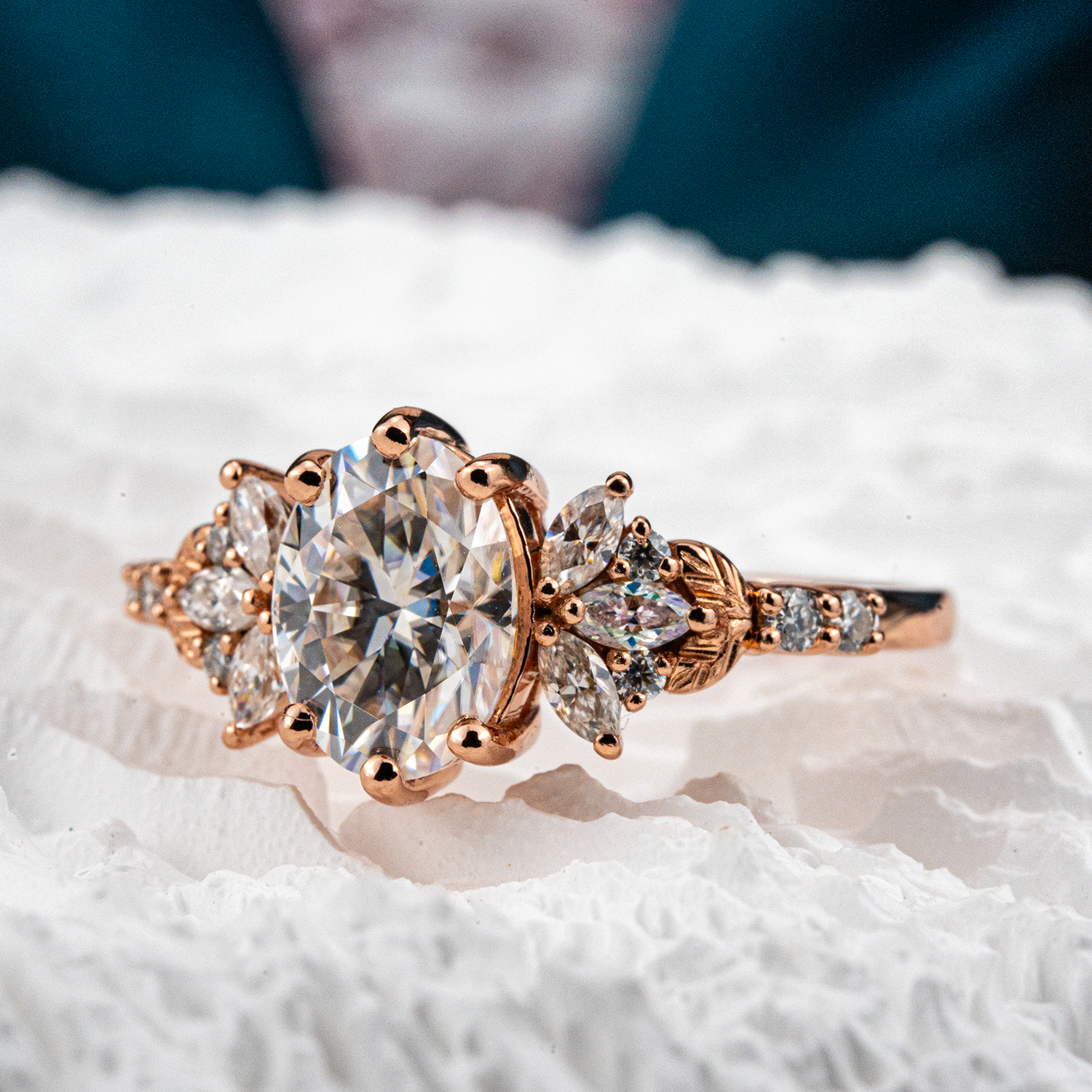Elegant handmade oval moissanite ring featuring a delicate leaf motif, perfect for adding a touch of nature to your look.