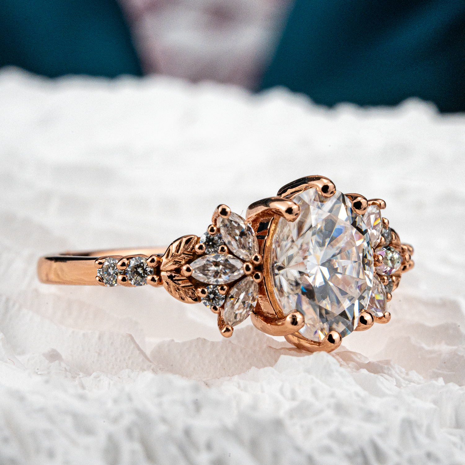 Elegant handmade oval moissanite ring featuring a delicate leaf motif, perfect for adding a touch of nature to your look.