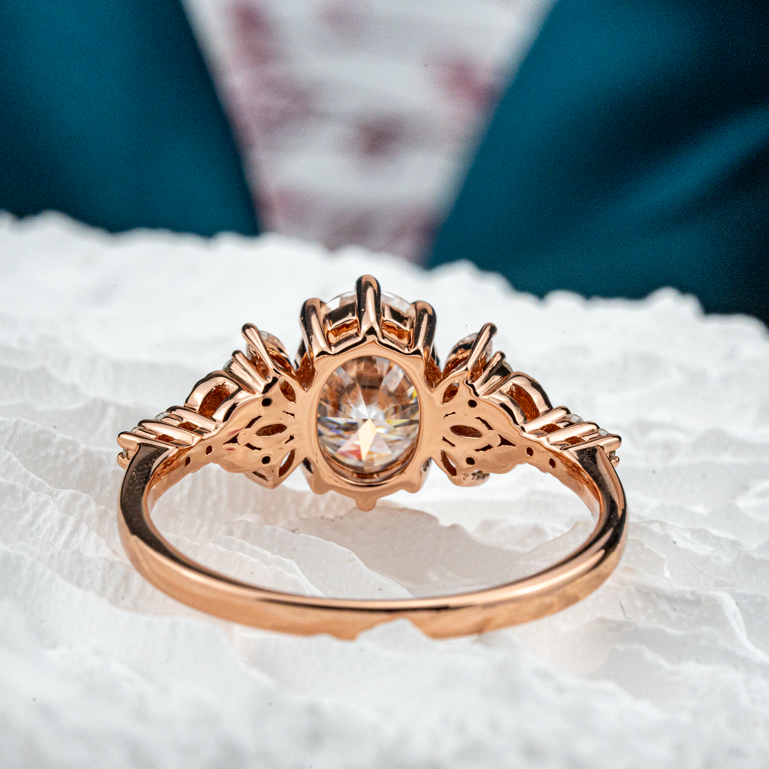 Elegant handmade oval moissanite ring featuring a delicate leaf motif, perfect for adding a touch of nature to your look.