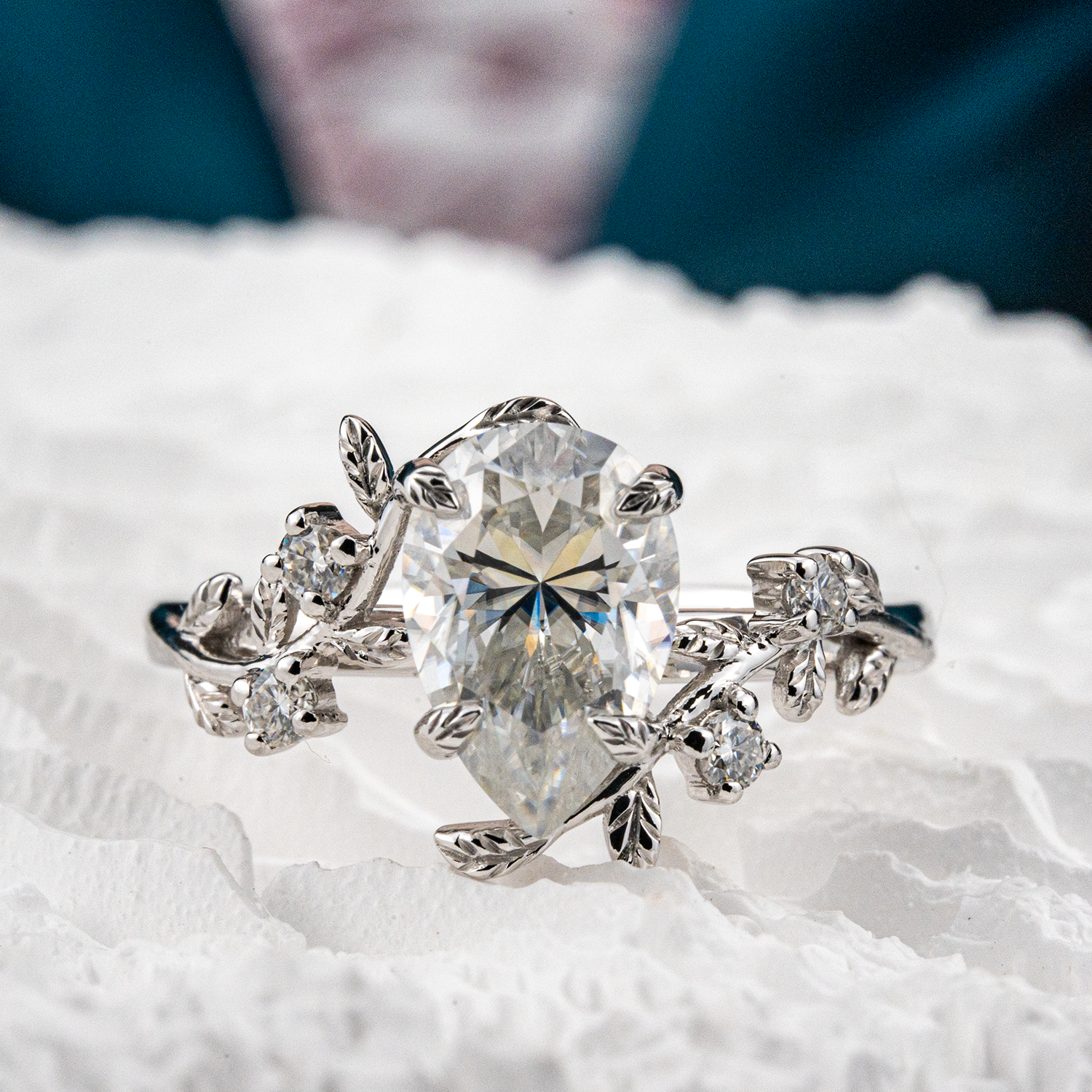 White Gold Pear Moissanite Ring crafted in nature inspired setting for unique and stylish appeal