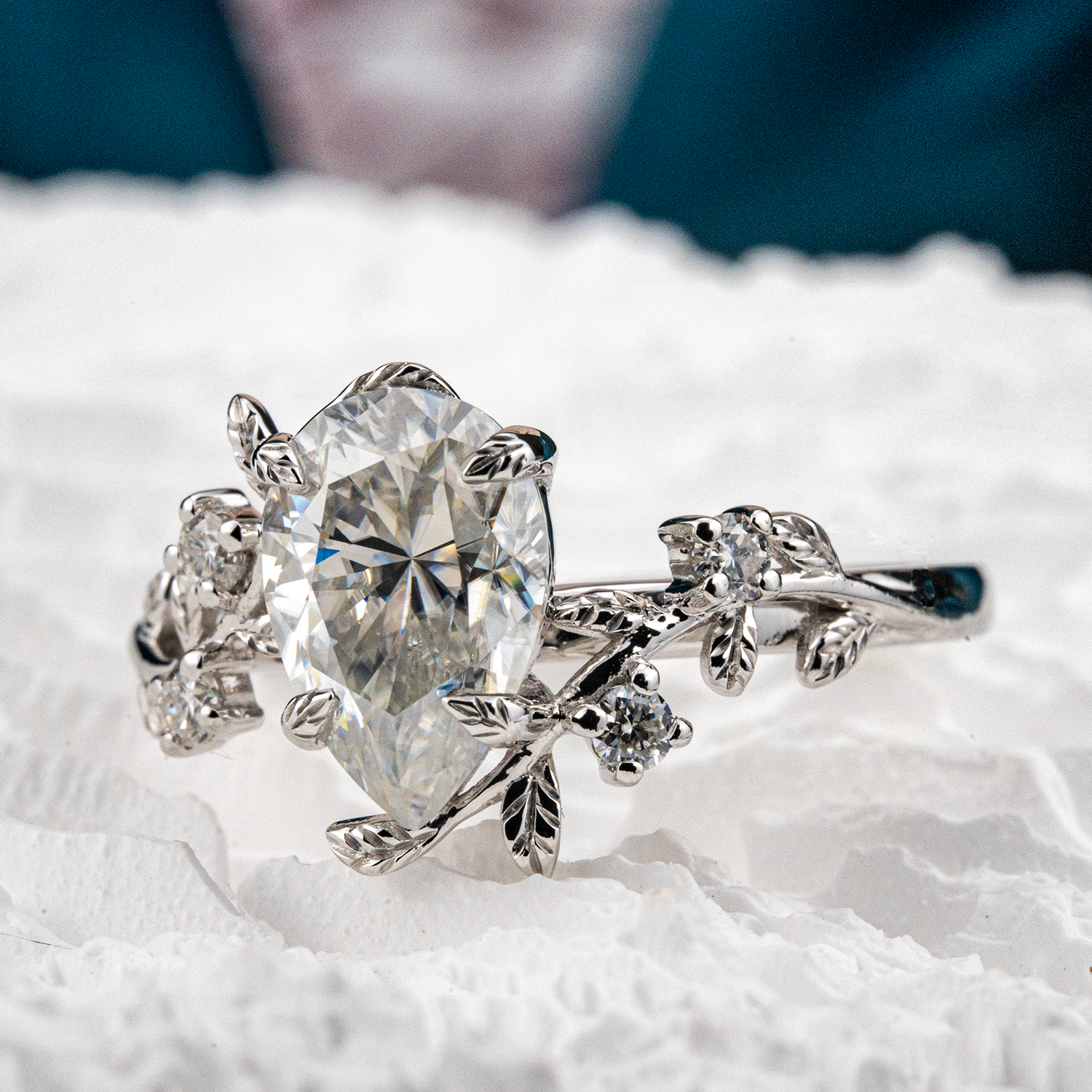 White Gold Pear Moissanite Ring crafted in nature inspired setting for unique and stylish appeal
