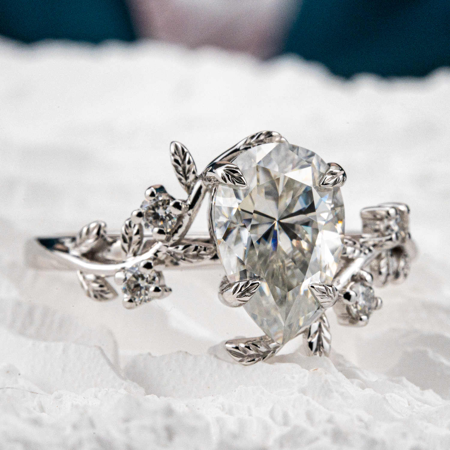 White Gold Pear Moissanite Ring crafted in nature inspired setting for unique and stylish appeal