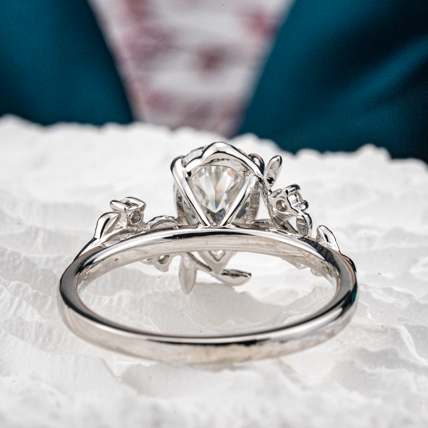 White Gold Pear Moissanite Ring crafted in nature inspired setting for unique and stylish appeal