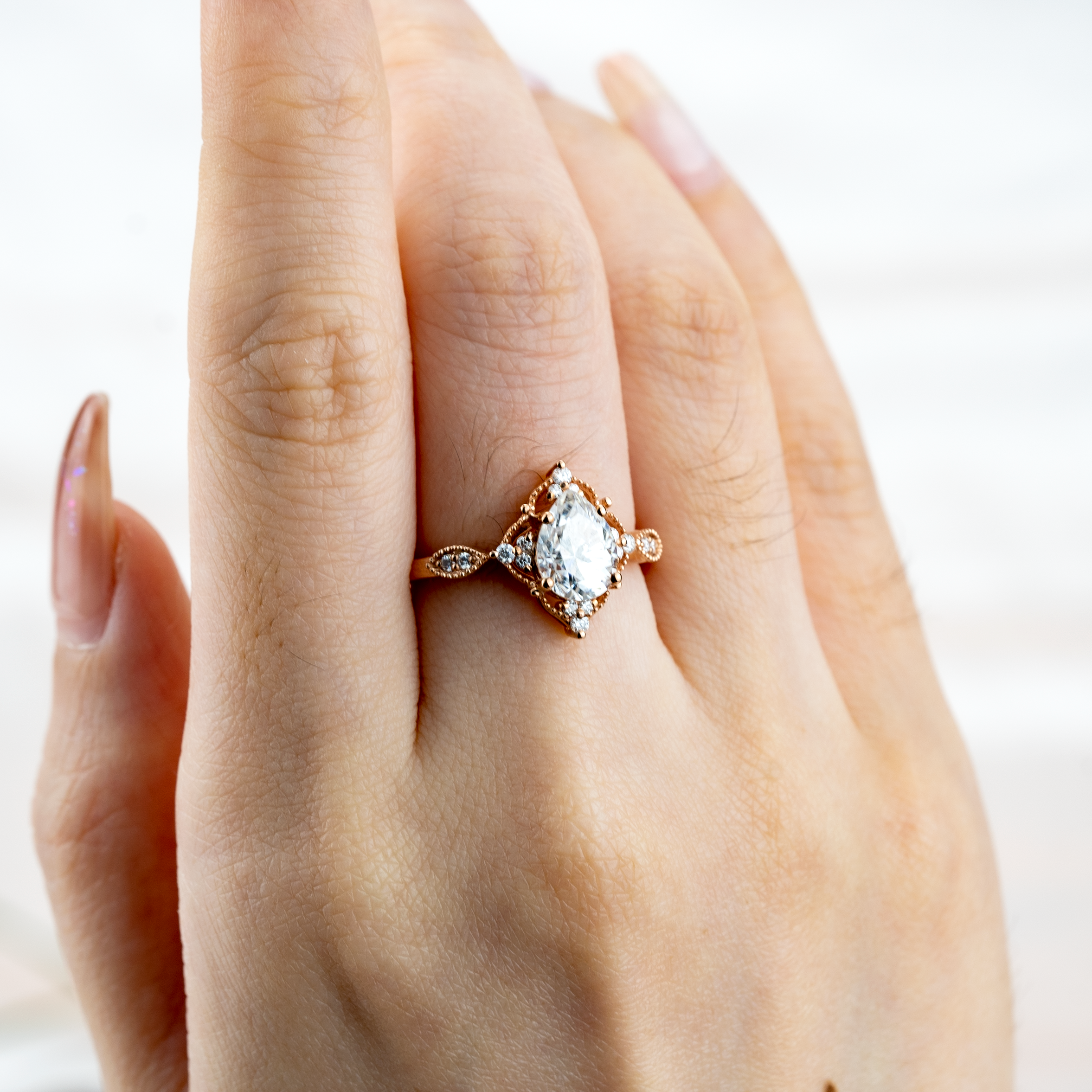 Exquisite pear Moissanite ring in stunning rose gold, perfect for vintage-inspired engagement