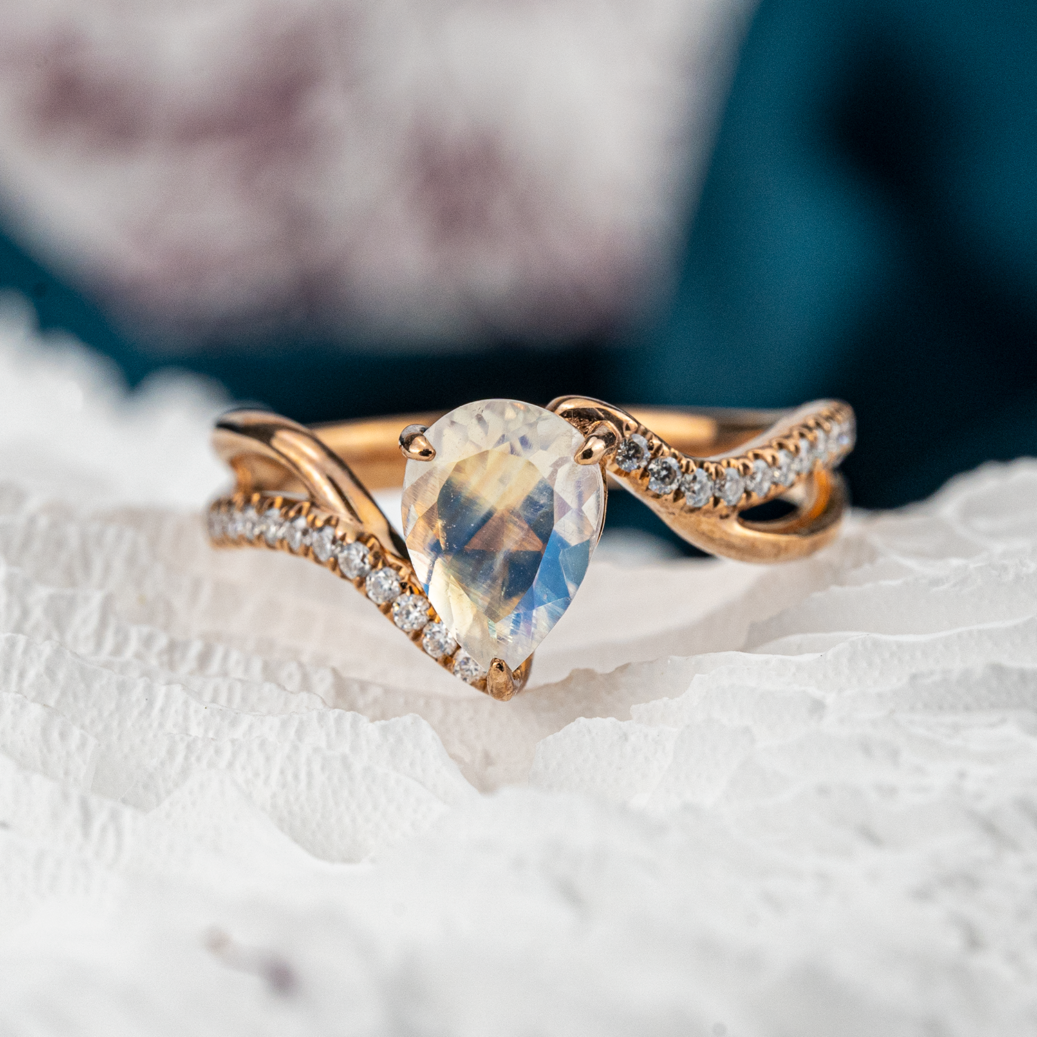 Luxurious moonstone engagement ring featuring pear cut stone