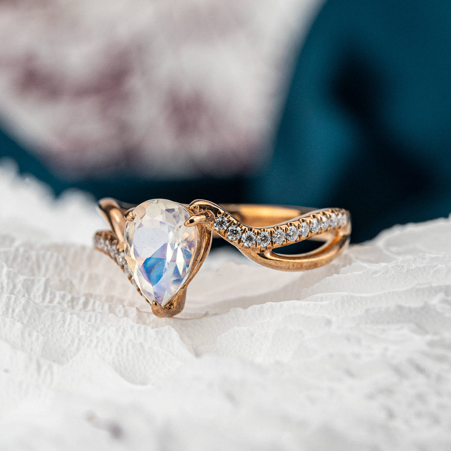 Luxurious moonstone engagement ring featuring pear cut stone