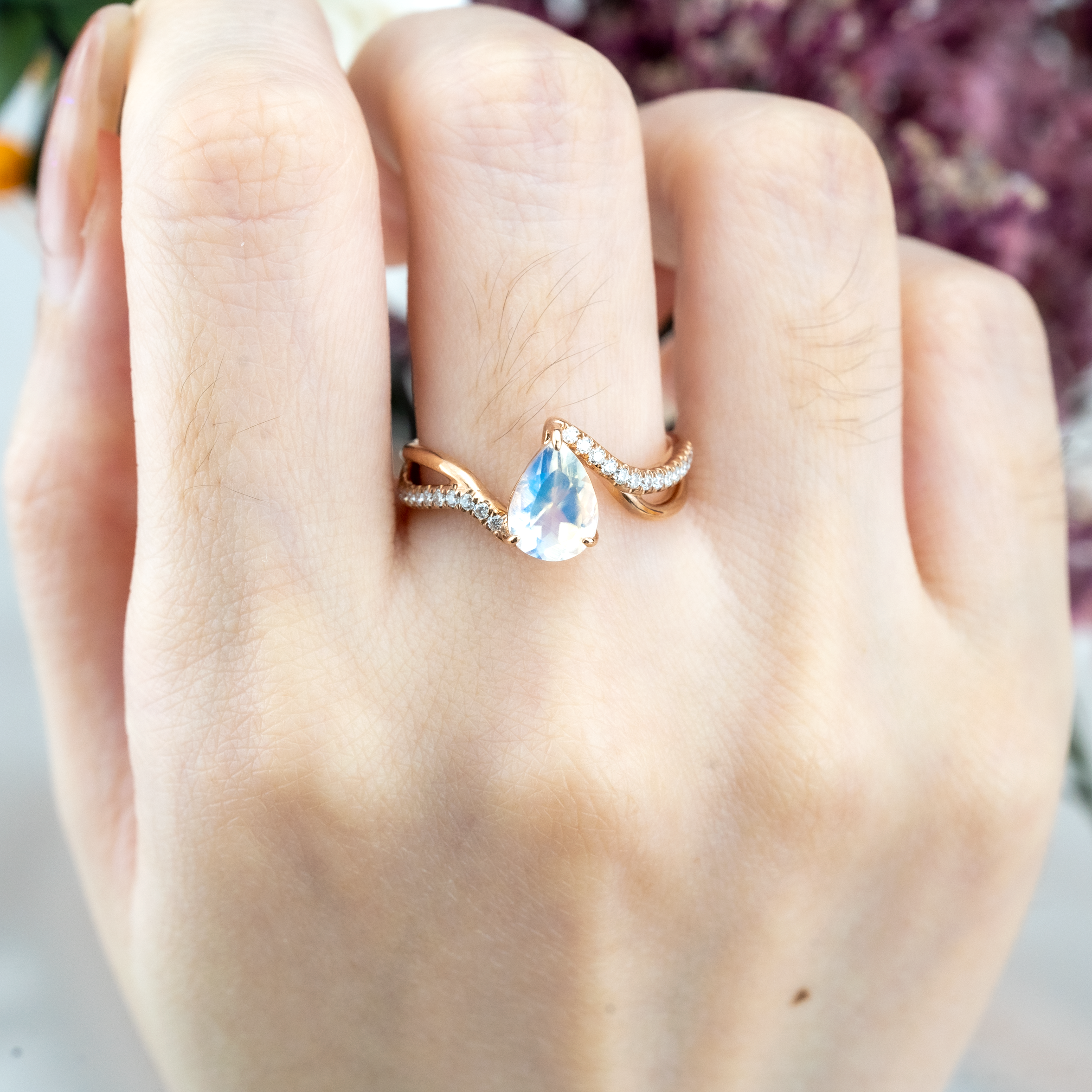 Luxurious moonstone engagement ring featuring pear cut stone