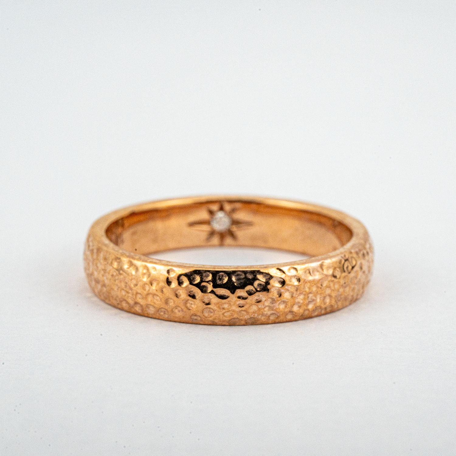 Stylish promise ring crafted in a classic hammered pattern, perfect for making a lasting commitment.