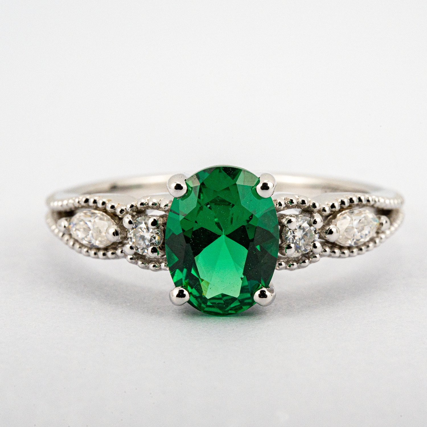 Shimmering Oval Emerald Ring in White Gold - Luxury Jewelry