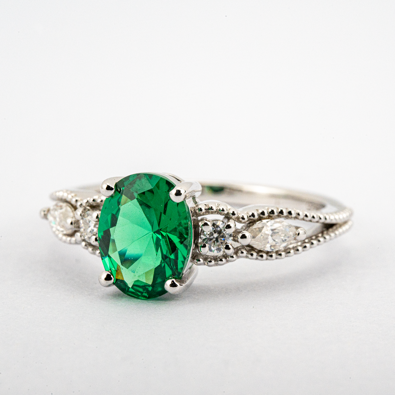 Shimmering Oval Emerald Ring in White Gold - Luxury Jewelry