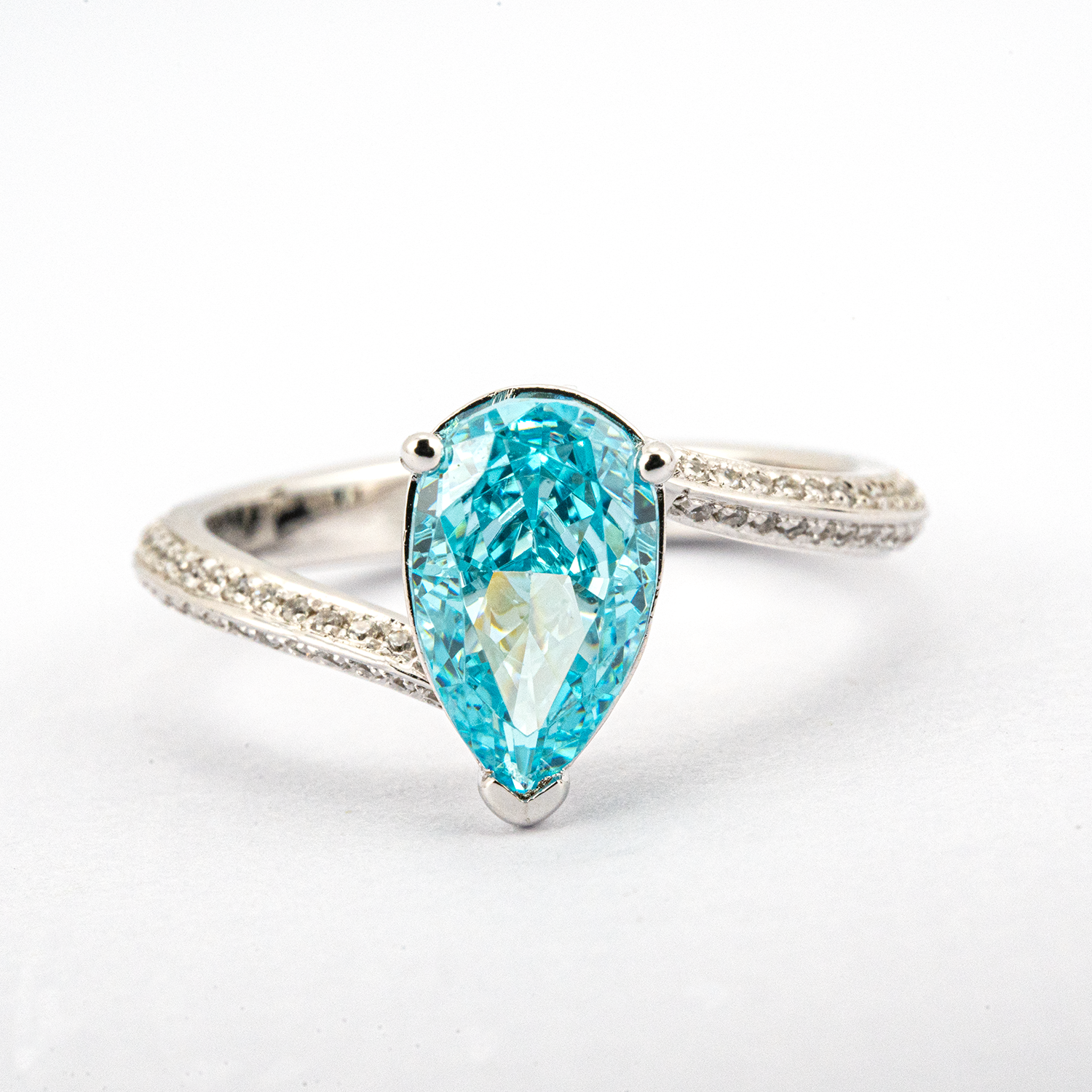 Elegant streamlined blue zircon ring featuring shimmering moissanite stones