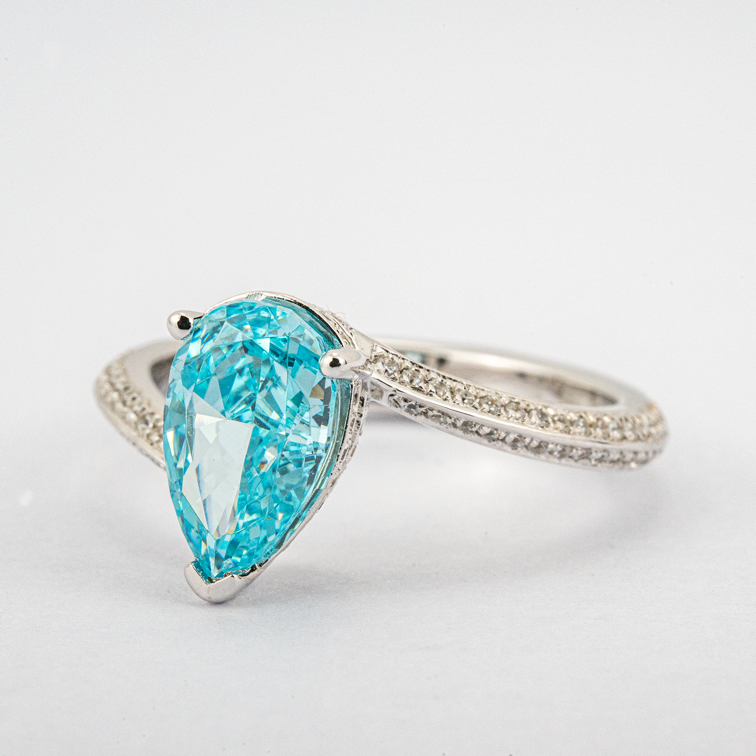 Elegant streamlined blue zircon ring featuring shimmering moissanite stones