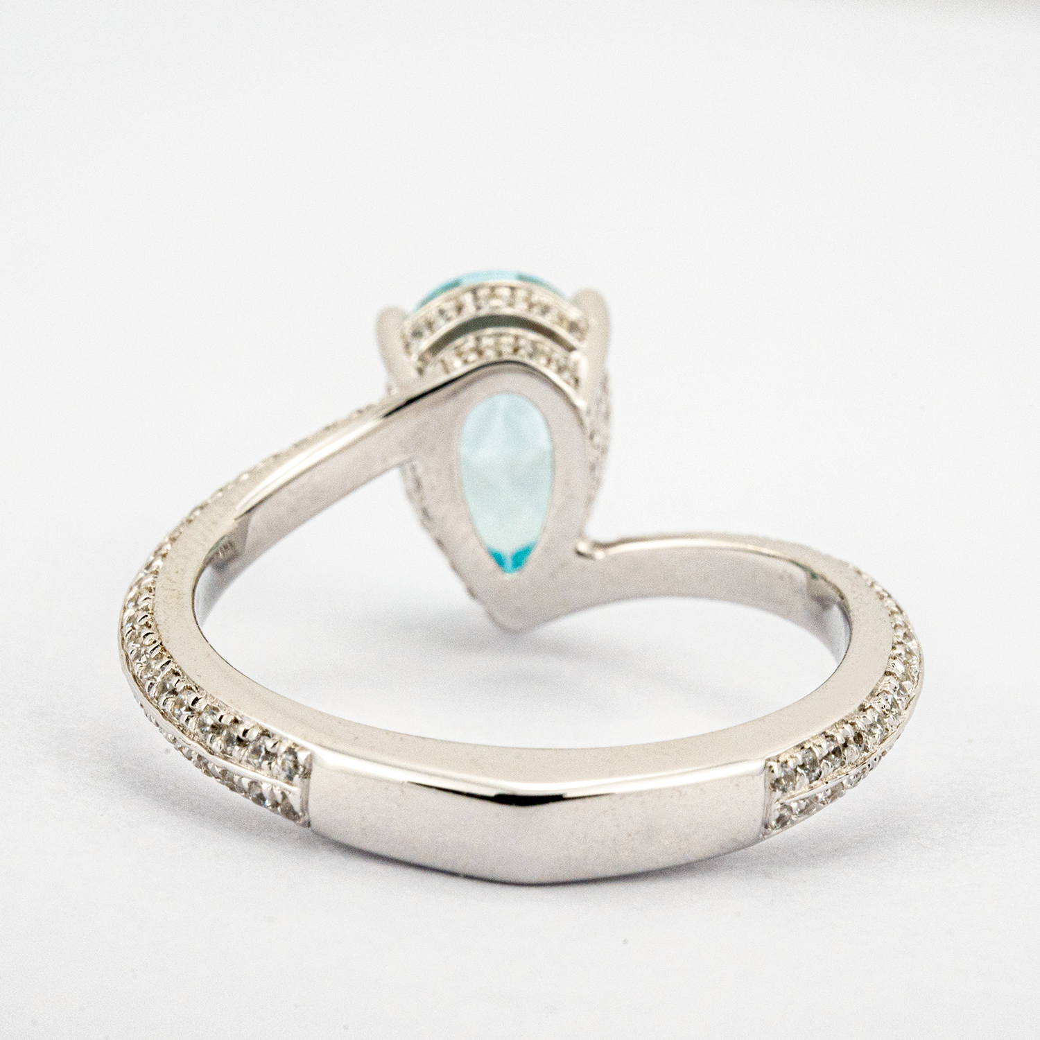 Elegant streamlined blue zircon ring featuring shimmering moissanite stones