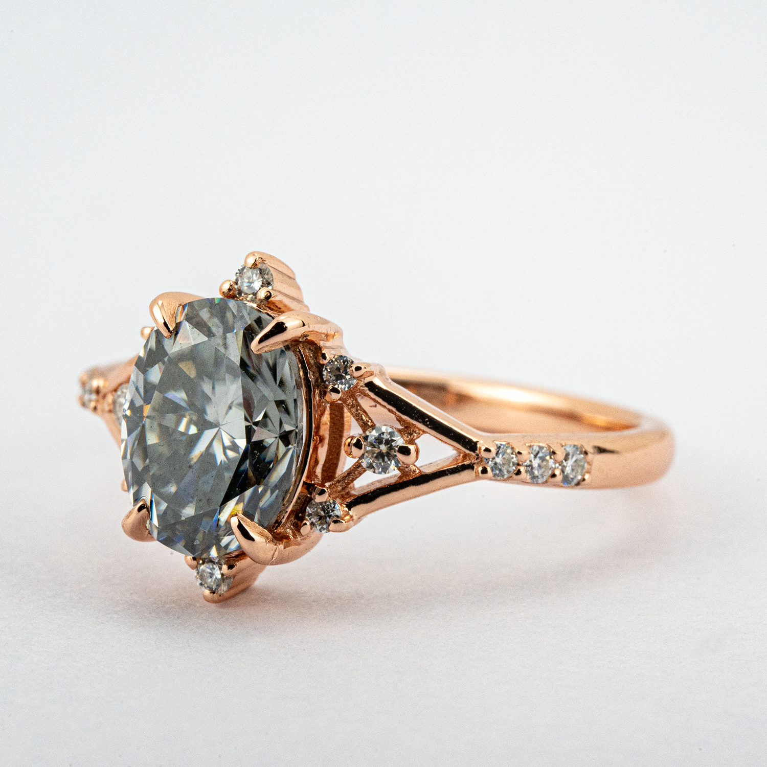Stylish minimalist wedding band featuring an oval gray stone, chic design