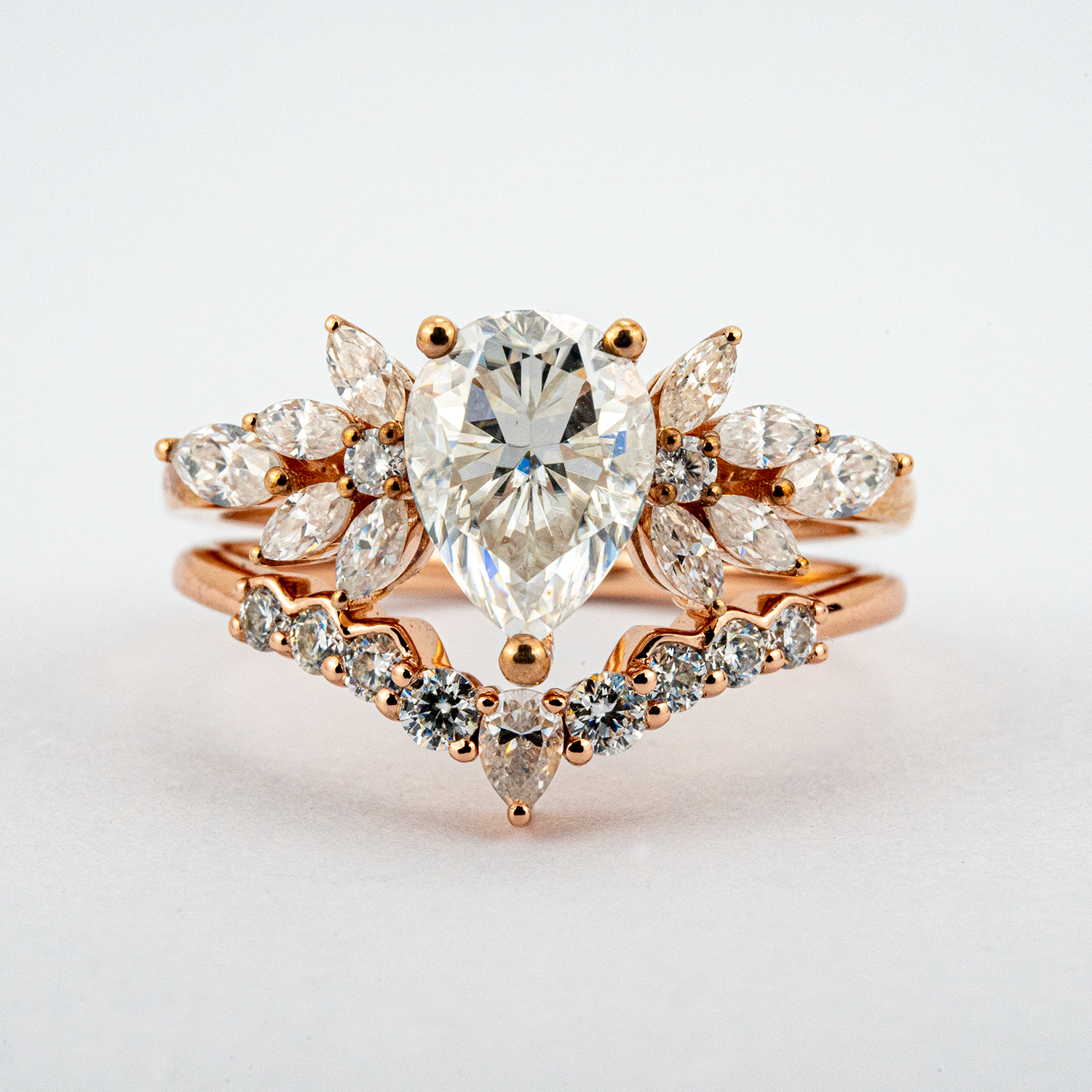 Exquisite pear moissanite ring set adorned with luxurious butterfly detail