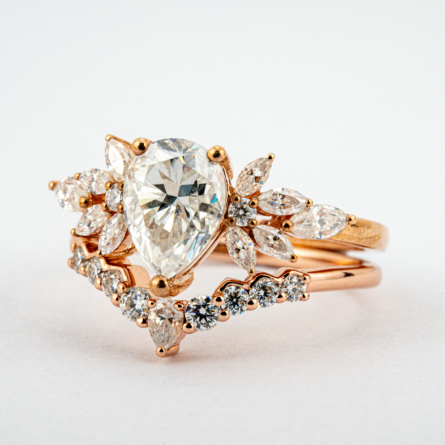 Exquisite pear moissanite ring set adorned with luxurious butterfly detail