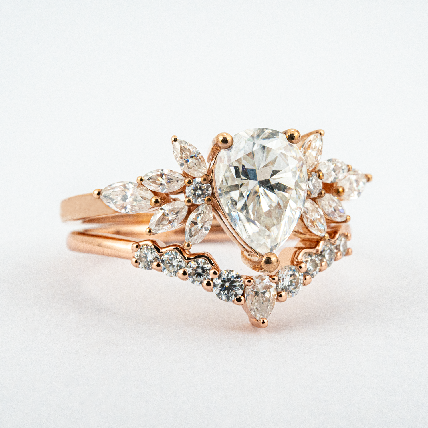 Exquisite pear moissanite ring set adorned with luxurious butterfly detail
