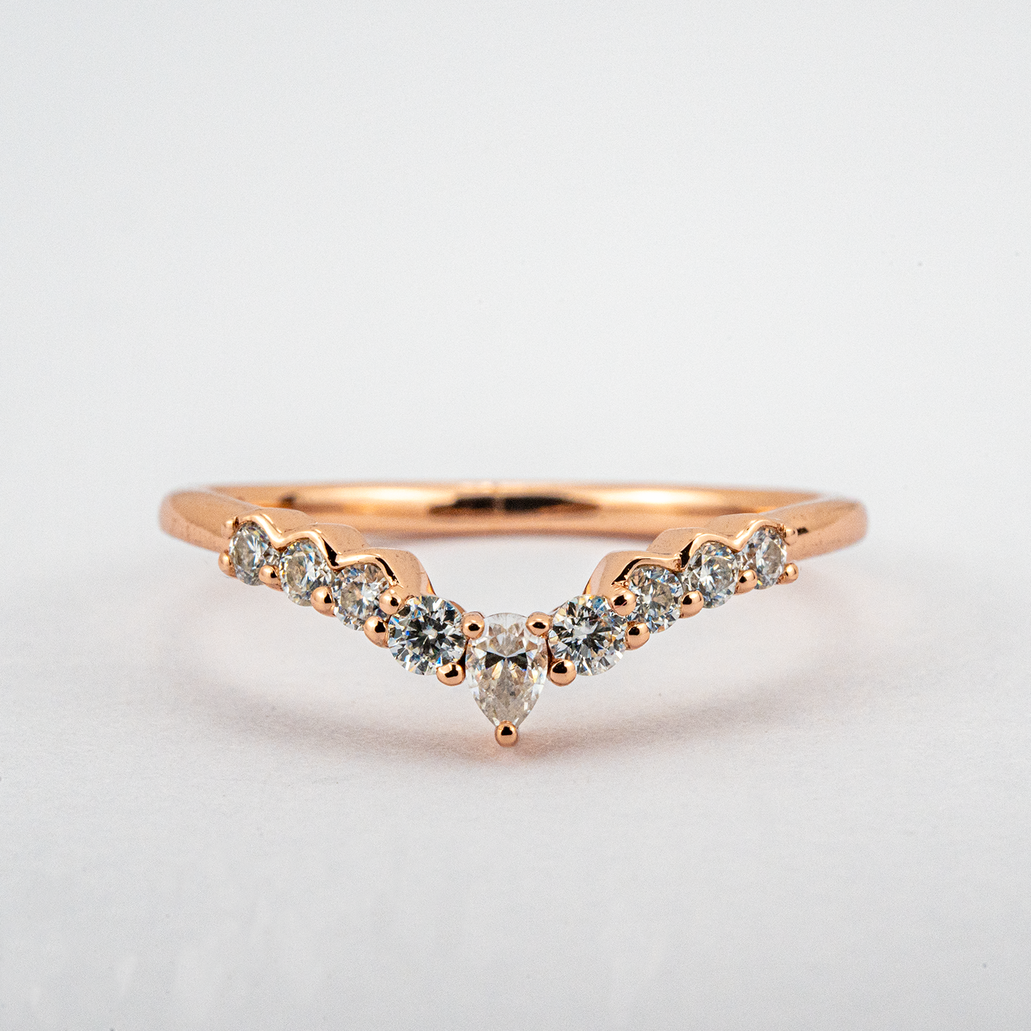 Exquisite pear moissanite ring set adorned with luxurious butterfly detail