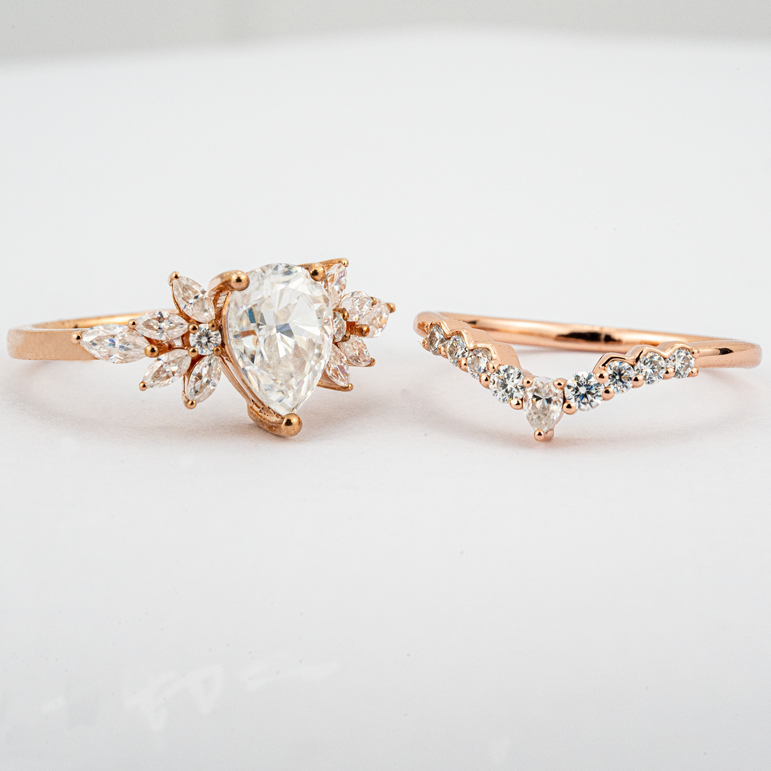 Exquisite pear moissanite ring set adorned with luxurious butterfly detail