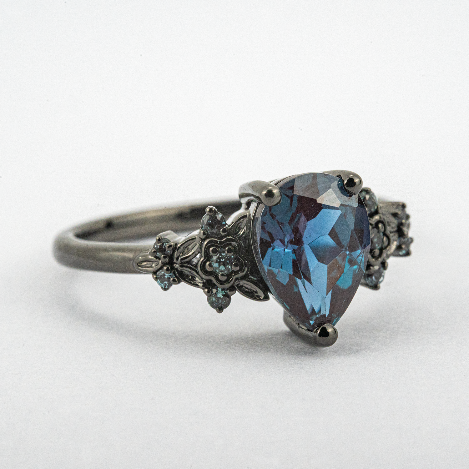 Stunning pear Alexandrite engagement ring set in black gold for timeless beauty