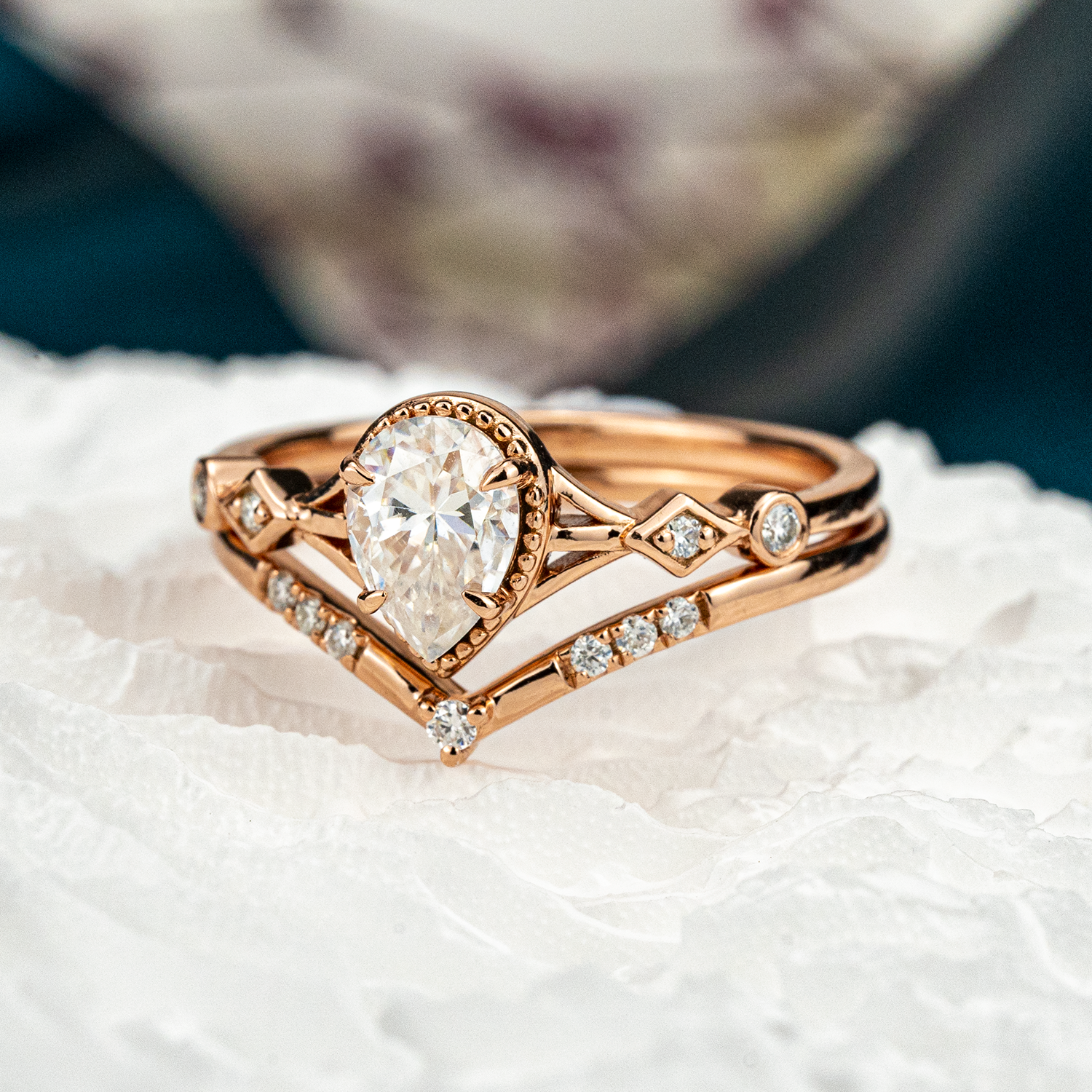 Stunning moissanite ring set with pear cut stones, showcasing timeless and classy design