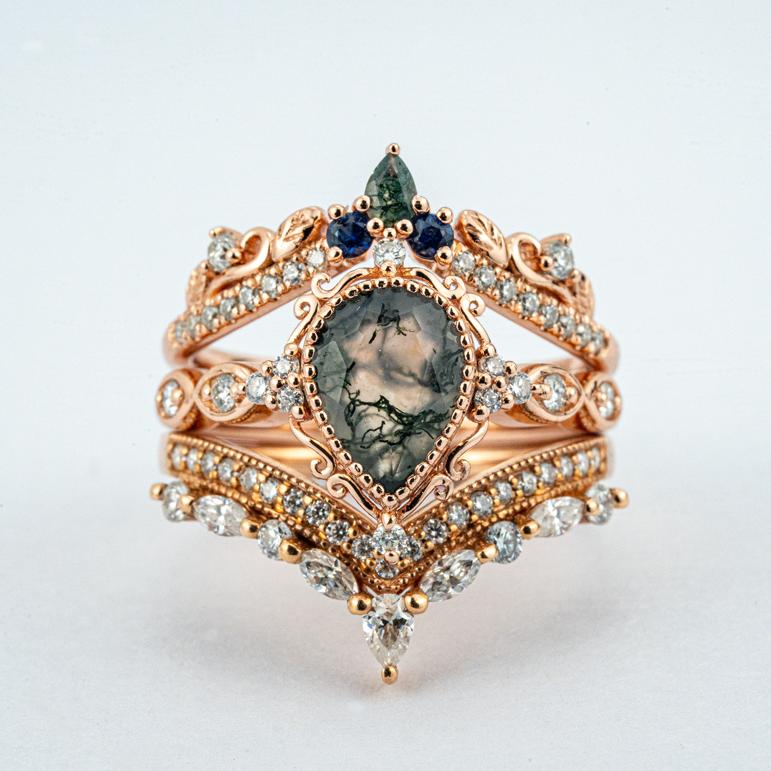 Exquisite wedding ring with pear moss agate stone, nature-inspired leaf design - luxurious and stunning