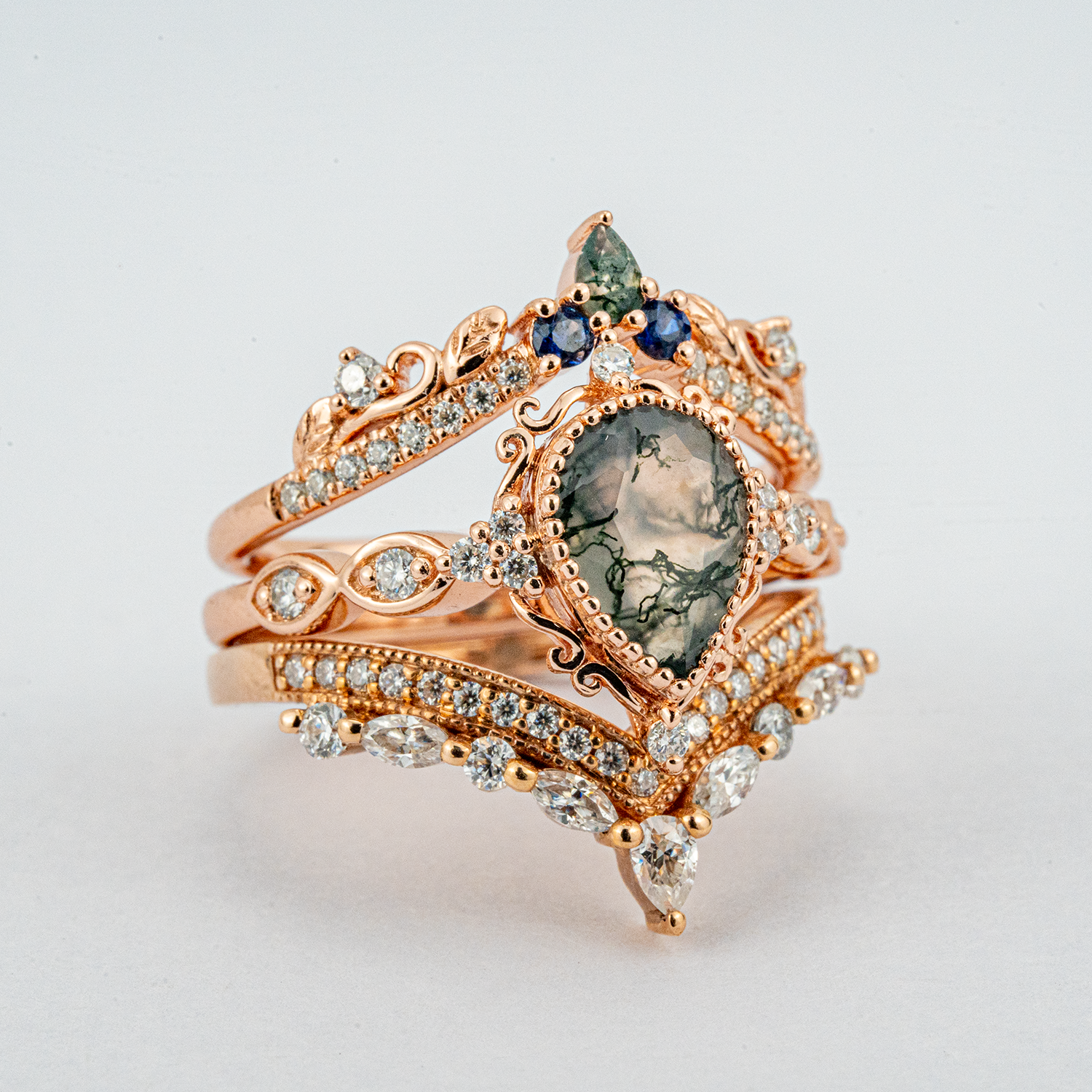 Exquisite wedding ring with pear moss agate stone, nature-inspired leaf design - luxurious and stunning