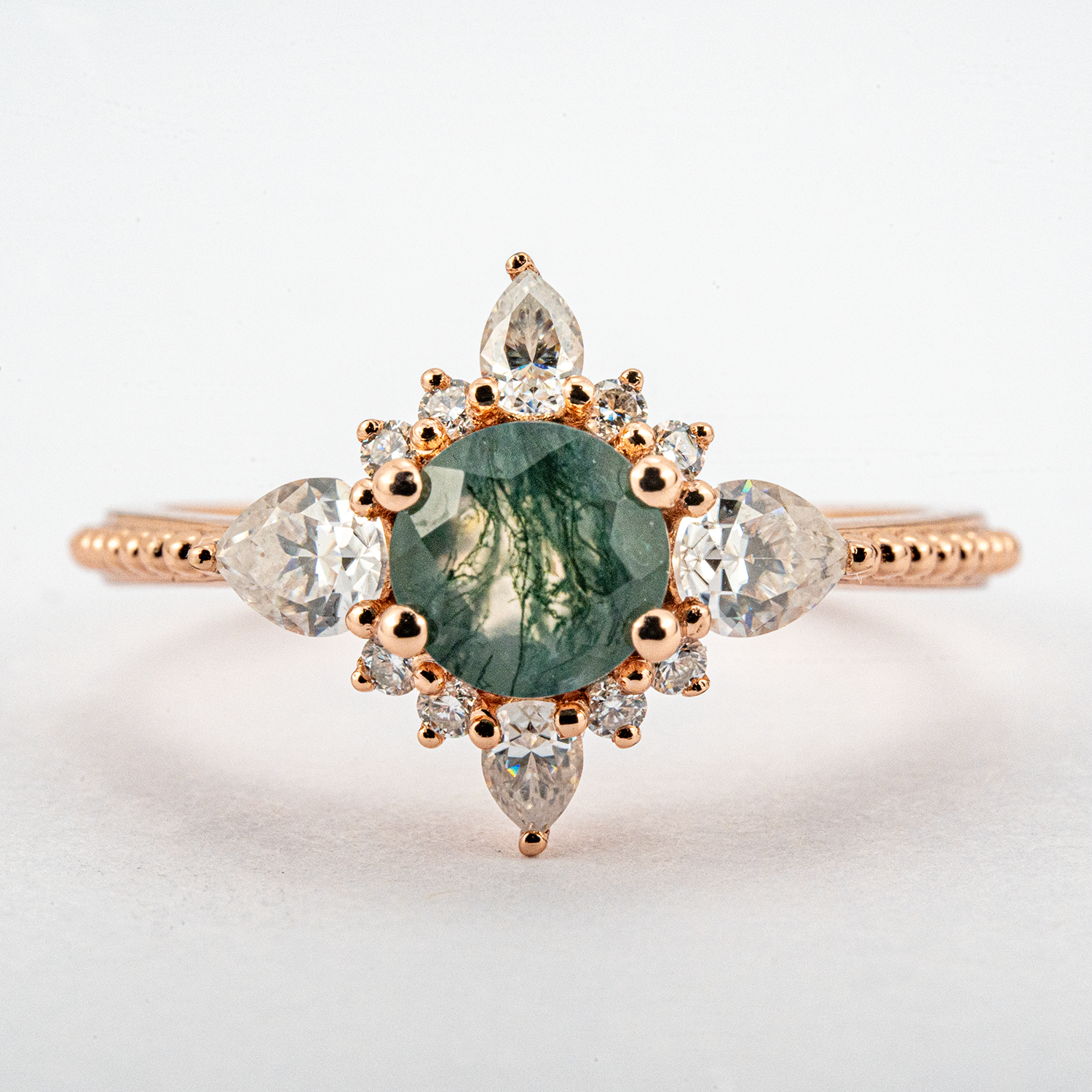 Handcrafted ring design with stunning moss agate and moissanite