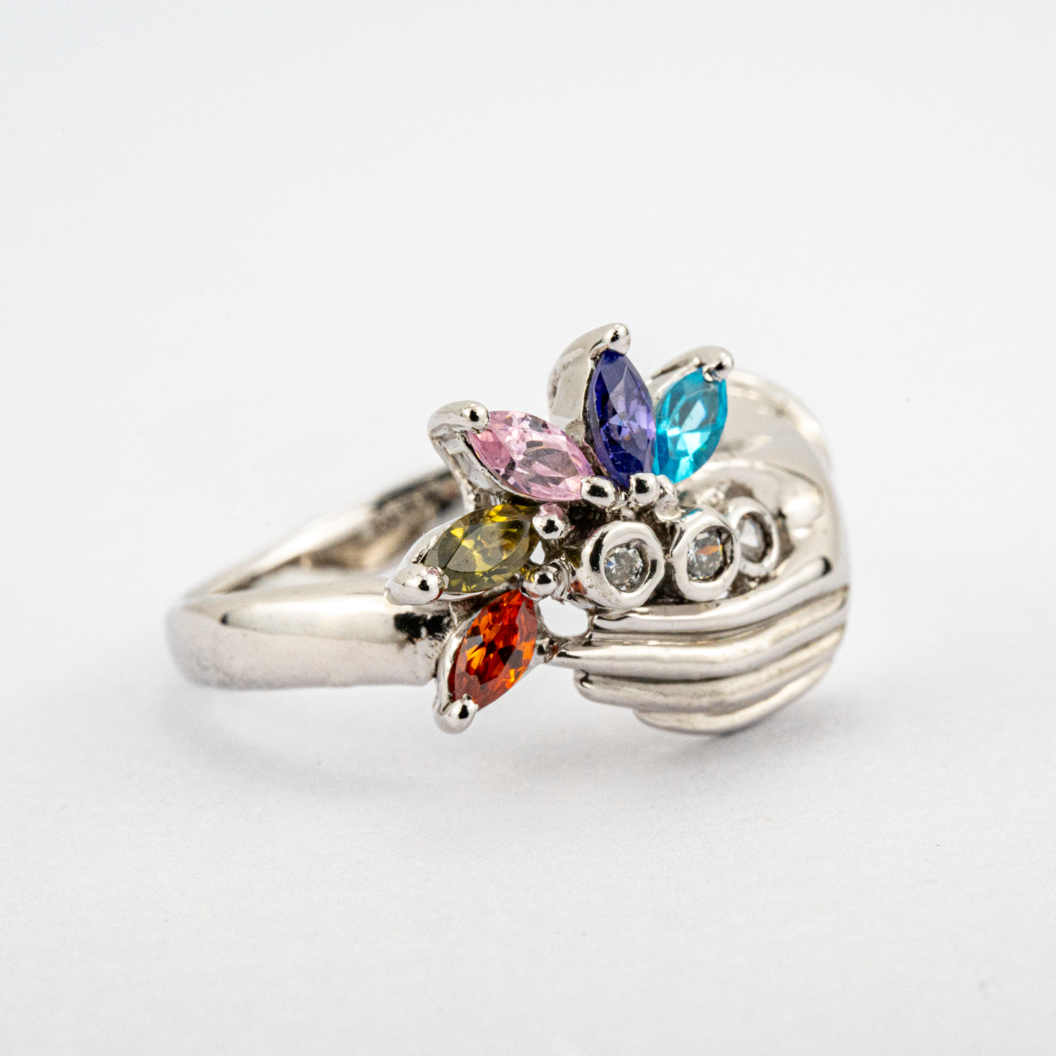 Unique white gold band featuring colorful gems for a striking accessory