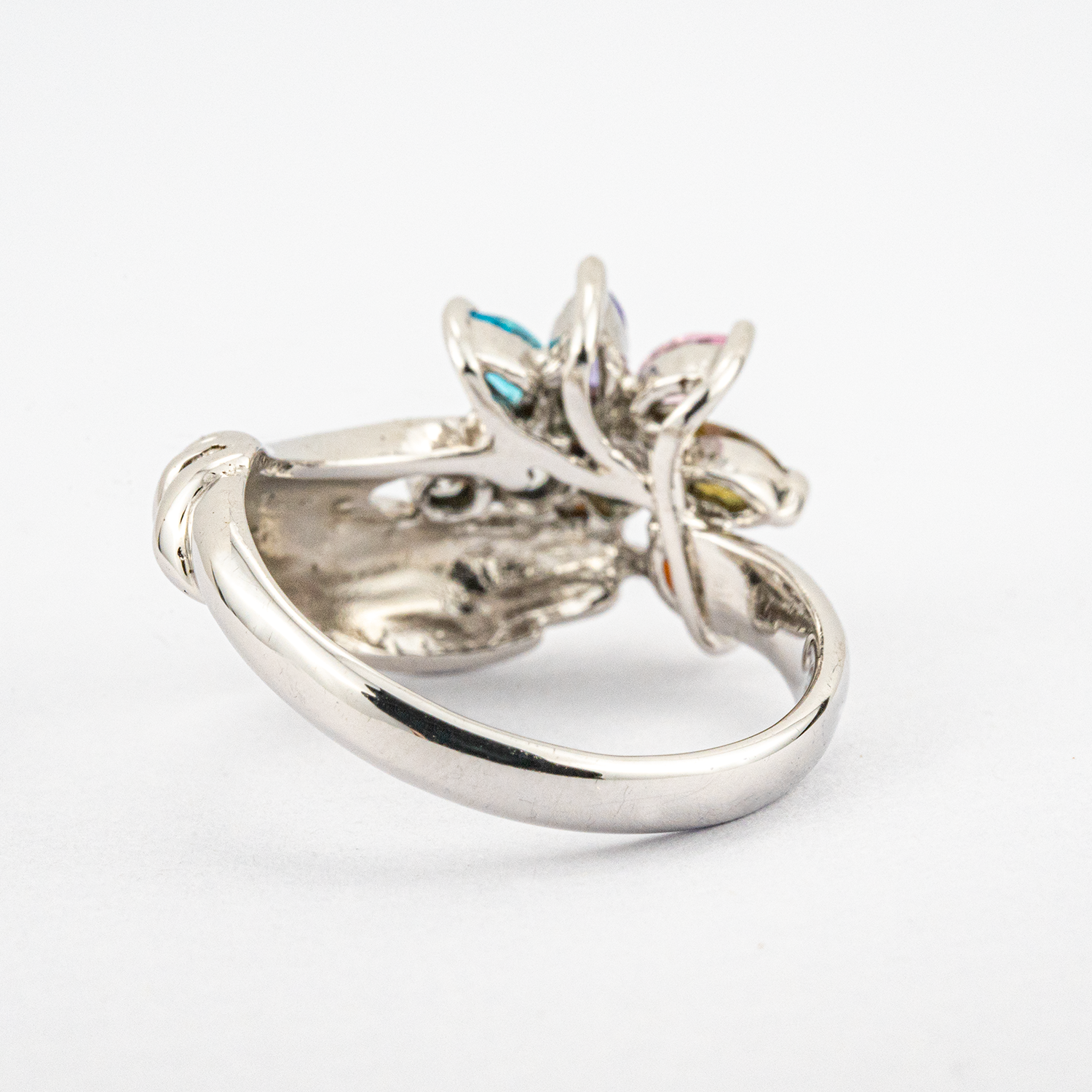 Unique white gold band featuring colorful gems for a striking accessory