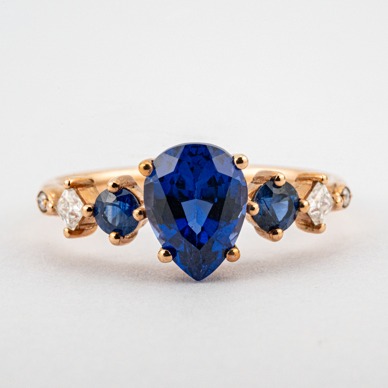 Gorgeous Sapphire engagement ring with stunning pear centerpiece