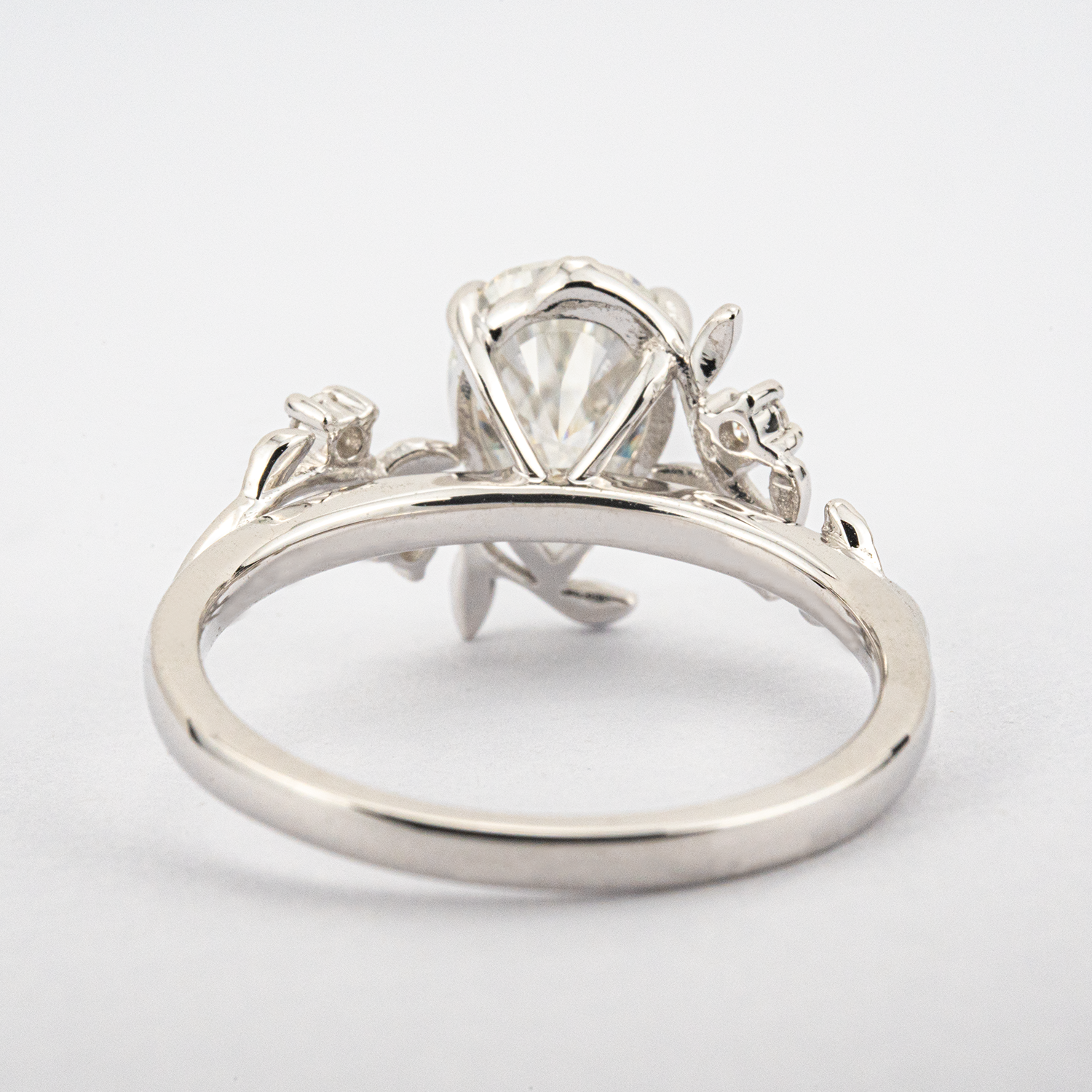 White Gold Pear Moissanite Ring crafted in nature inspired setting for unique and stylish appeal