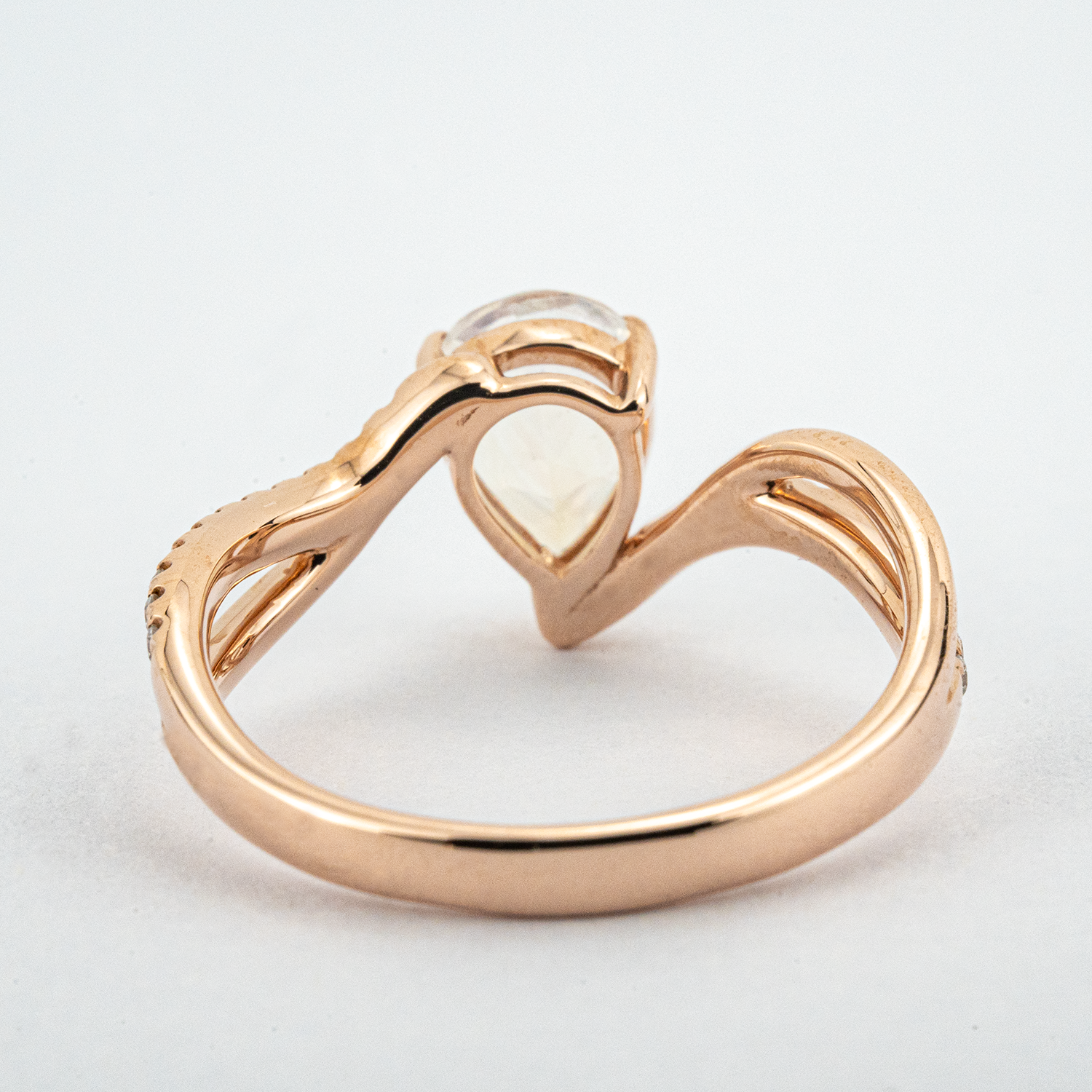 Luxurious moonstone engagement ring featuring pear cut stone