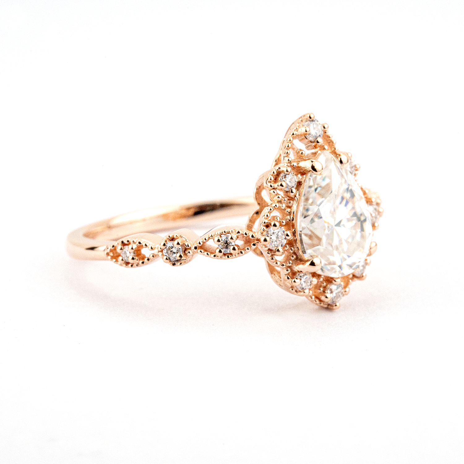 Luxurious Pear Shape Moissanite Rose Gold Three-Piece Set Unique Design Engagement Rings