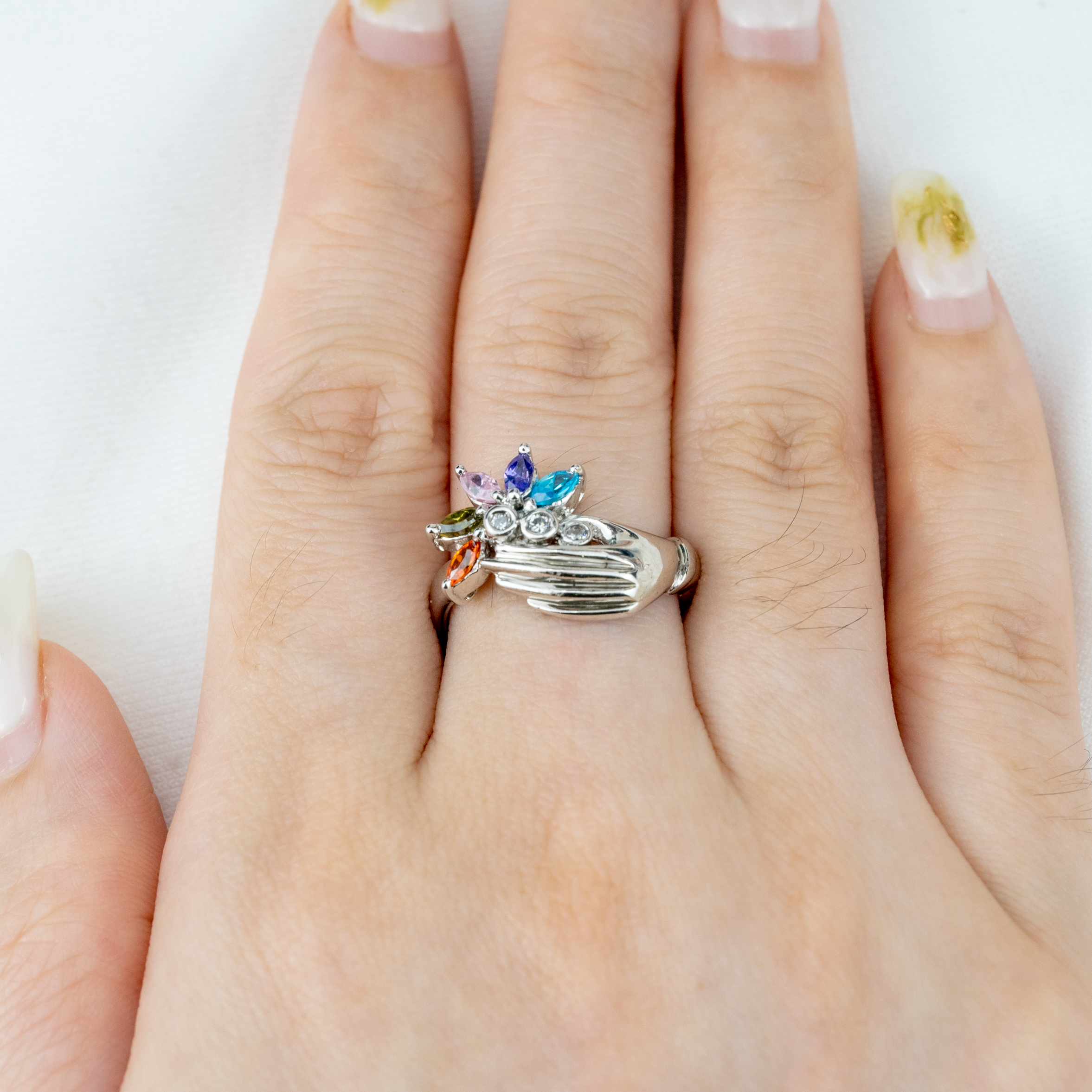 Unique white gold band featuring colorful gems for a striking accessory