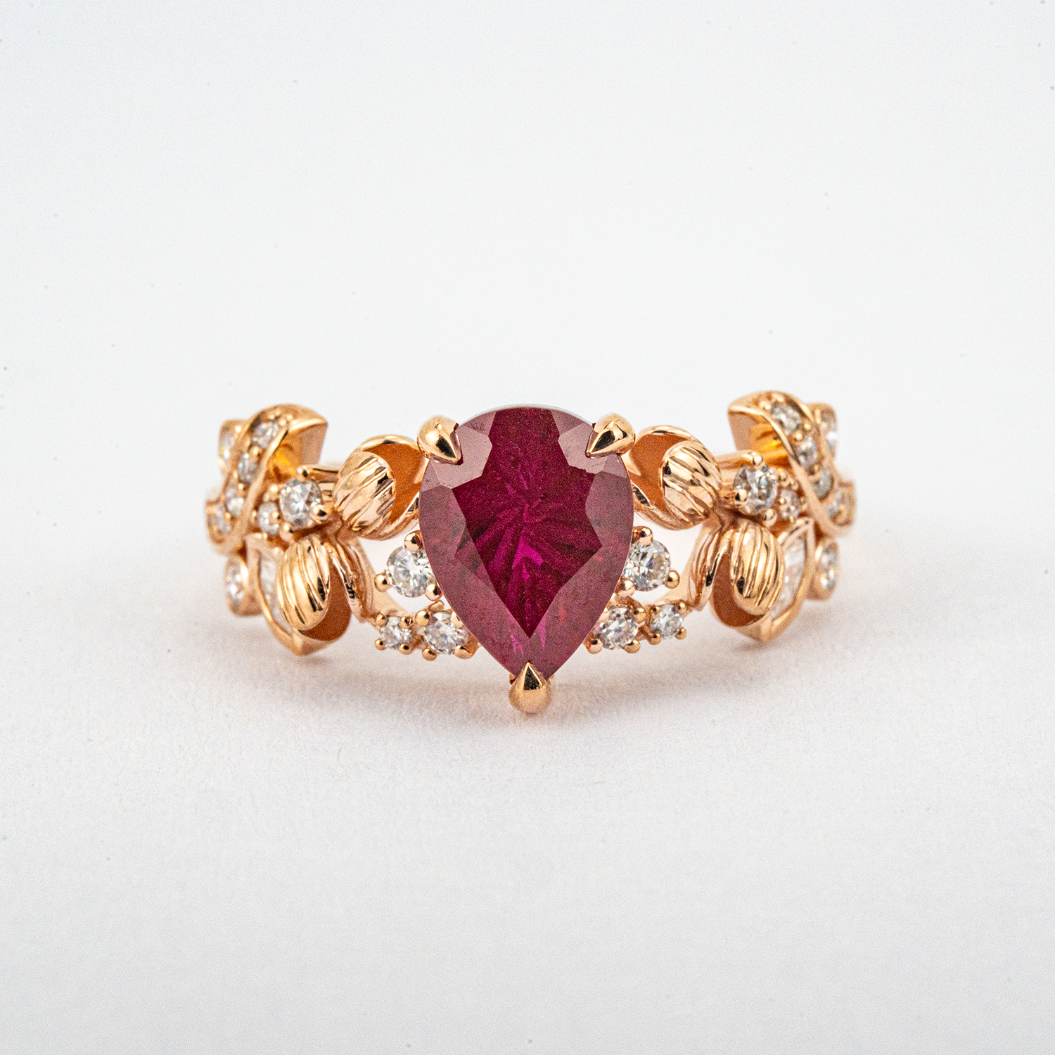 LUMINA - Pear-Shaped Garnet Leaf White Gold Ring with Nature-Inspired Design