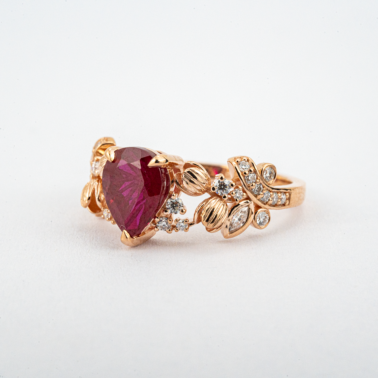 LUMINA - Pear-Shaped Garnet Leaf Rose Gold Ring with Nature-Inspired Design
