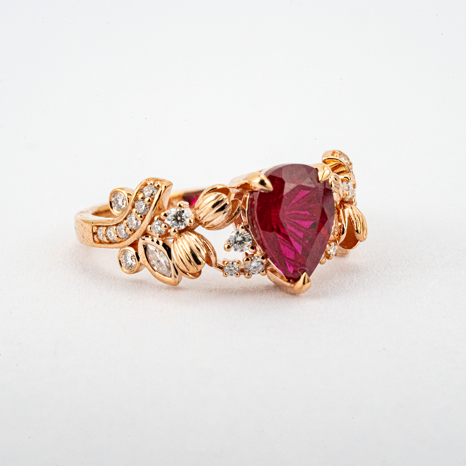 LUMINA - Pear-Shaped Garnet Leaf Rose Gold Ring with Nature-Inspired Design