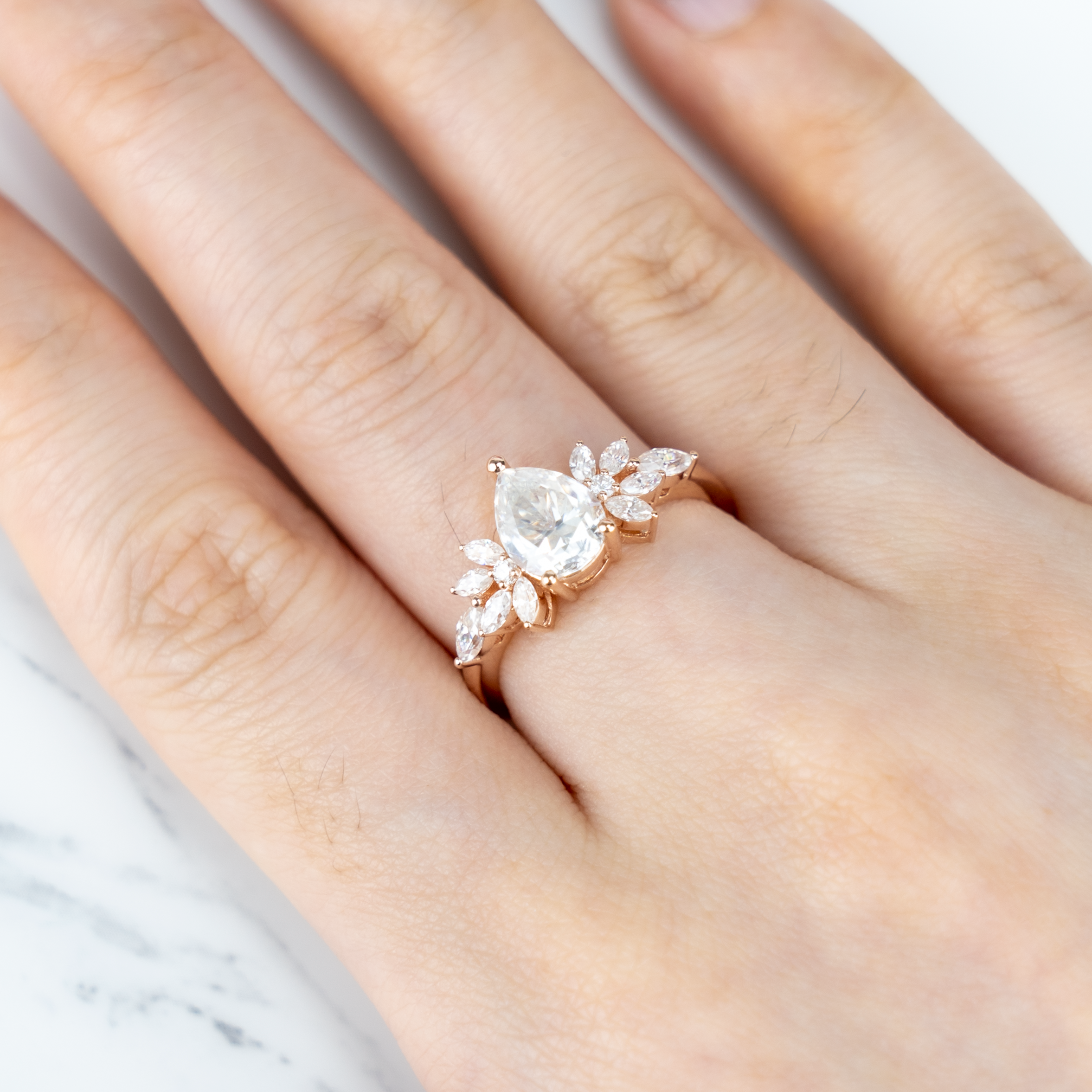 Luxurious Pear Moissanite Engagement Ring with intricate Butterfly design