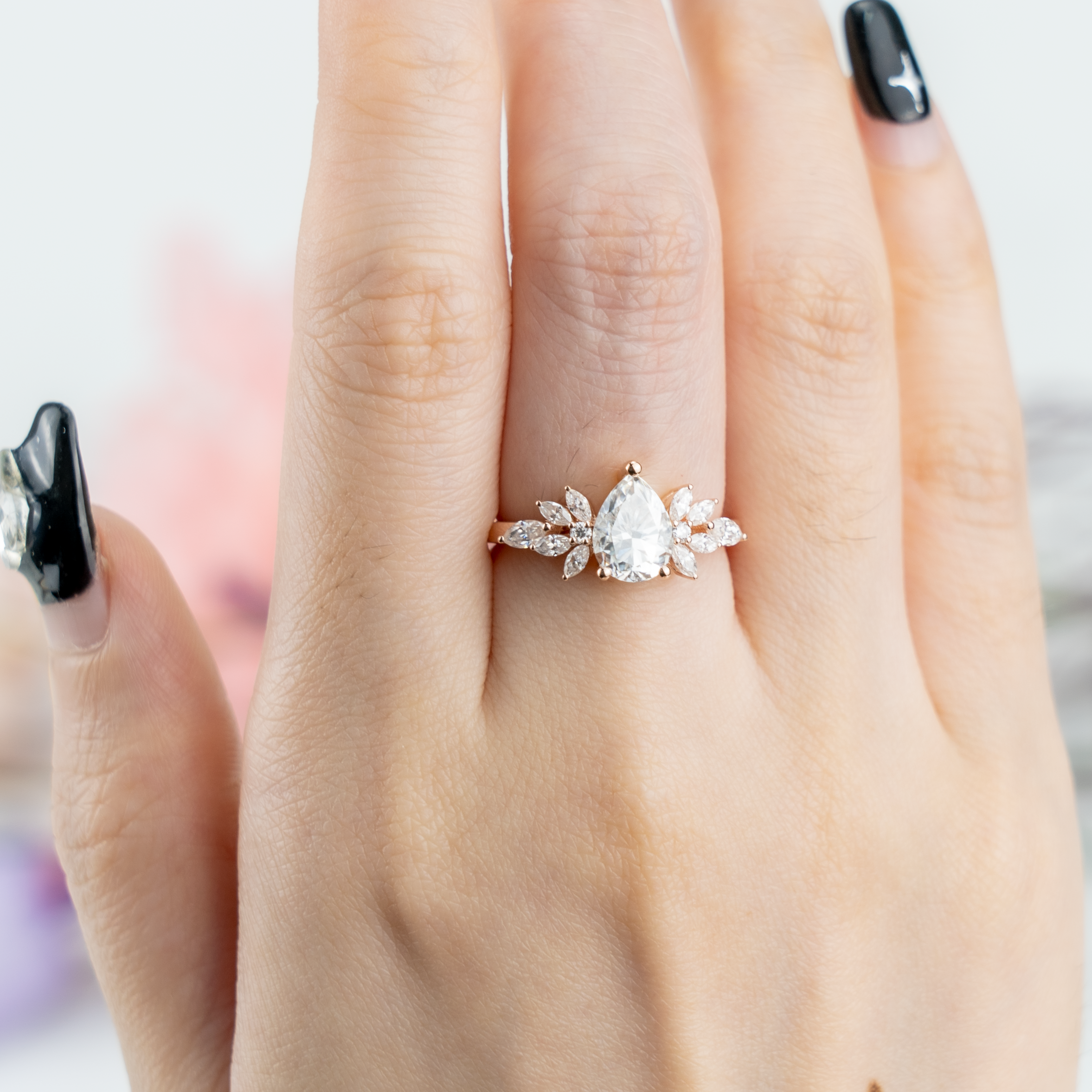 Luxurious Pear Moissanite Engagement Ring with intricate Butterfly design