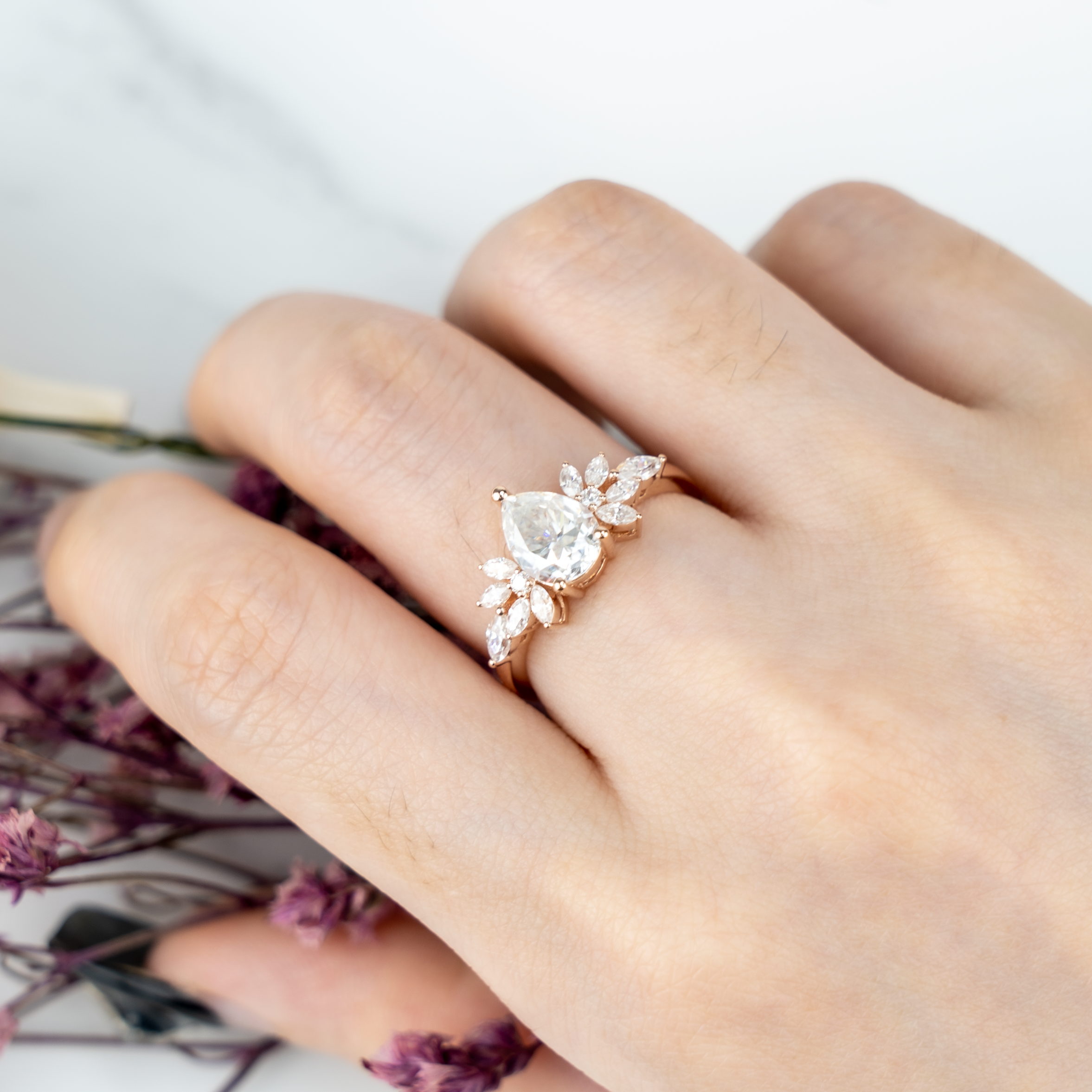 Luxurious Pear Moissanite Engagement Ring with intricate Butterfly design